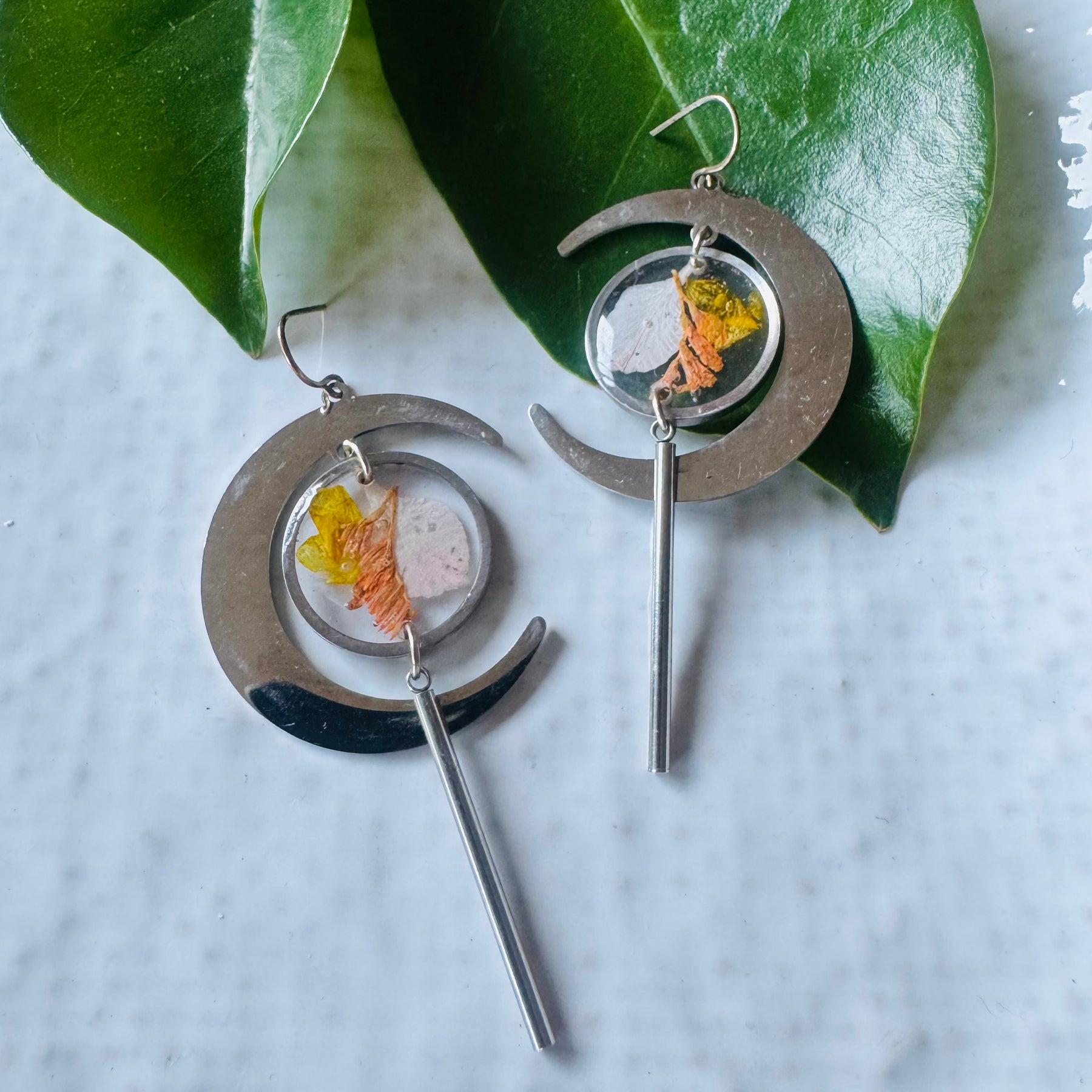 Silver moon earrings with pressed flowers