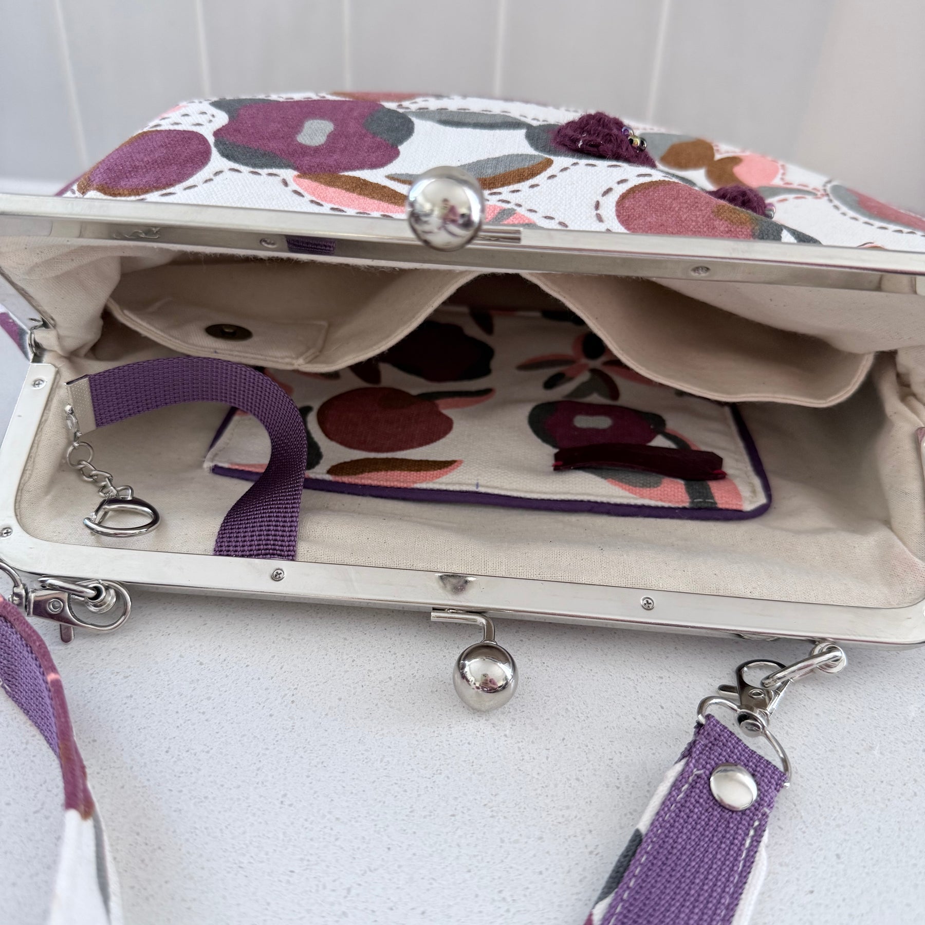 ‘Plum’ metal frame oversized purse