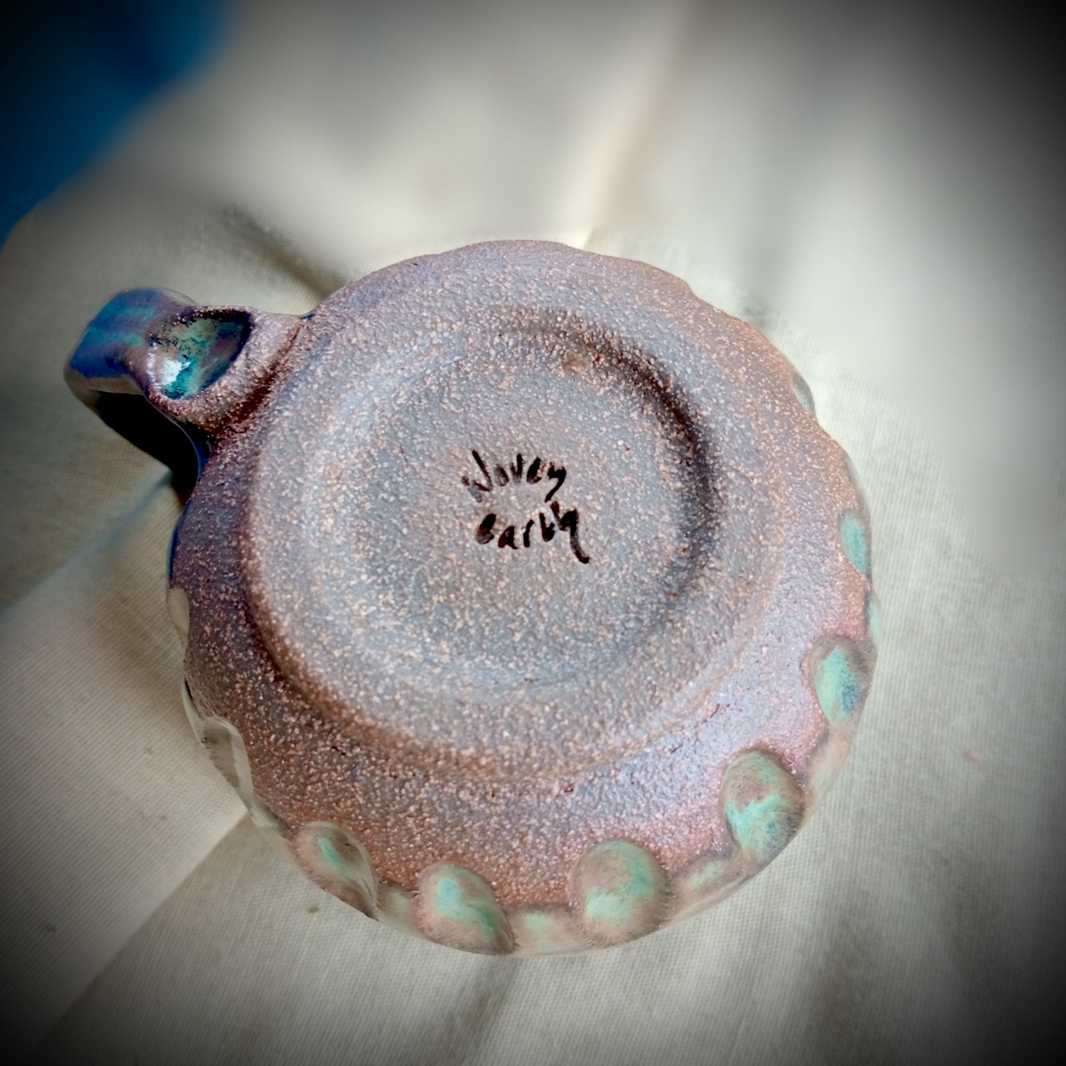 Blue & teal mug on rustic dark clay