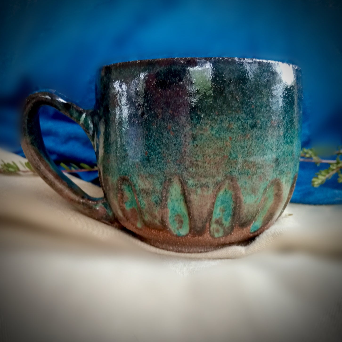 Blue & teal mug on rustic dark clay