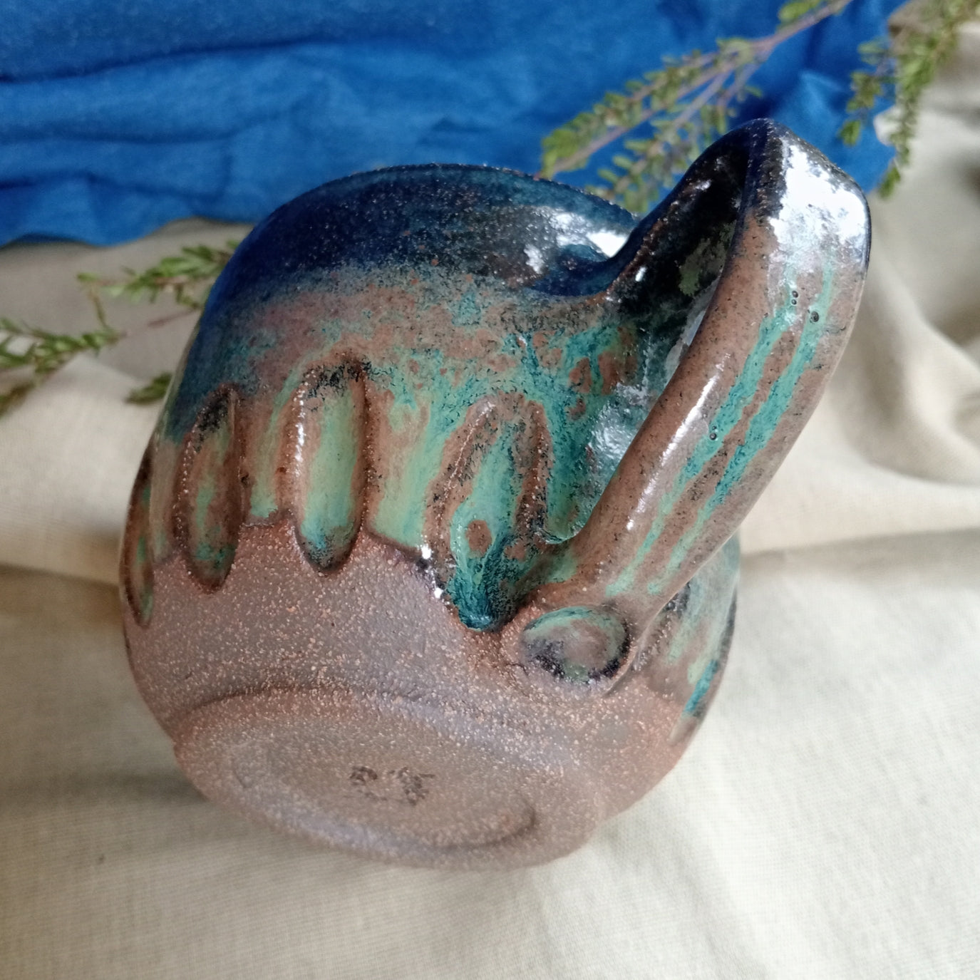 Blue & teal mug on rustic dark clay
