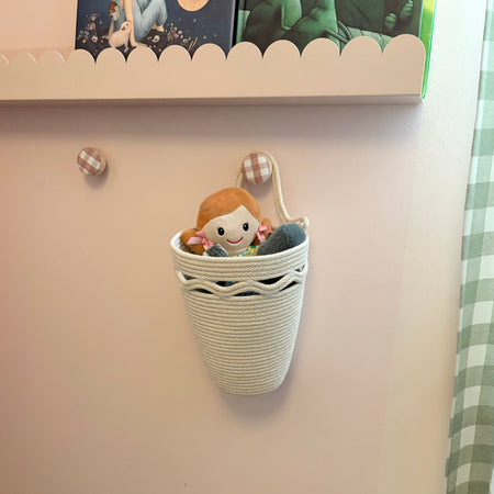 Hanging storage basket with wavy detail