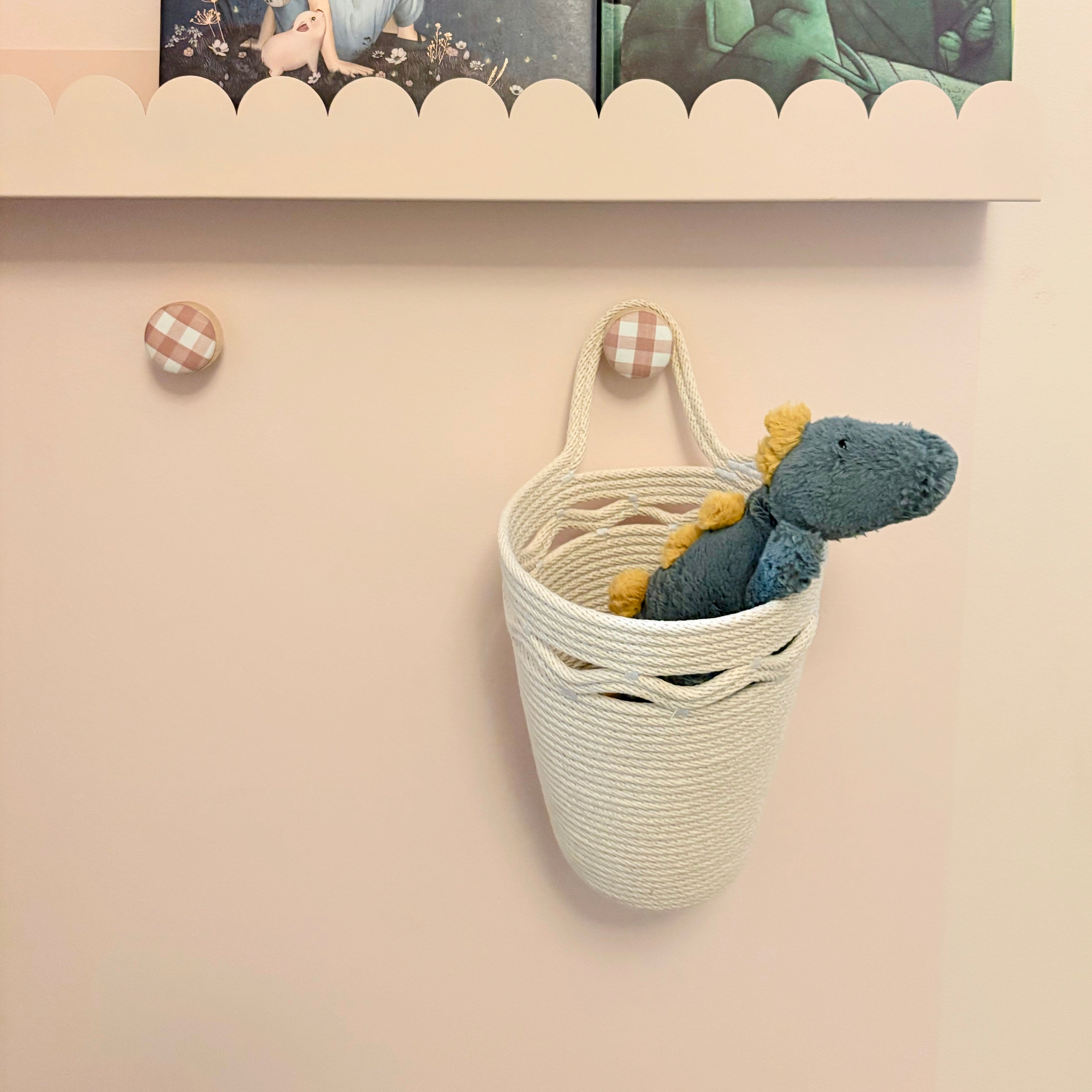 Hanging storage basket with wavy detail