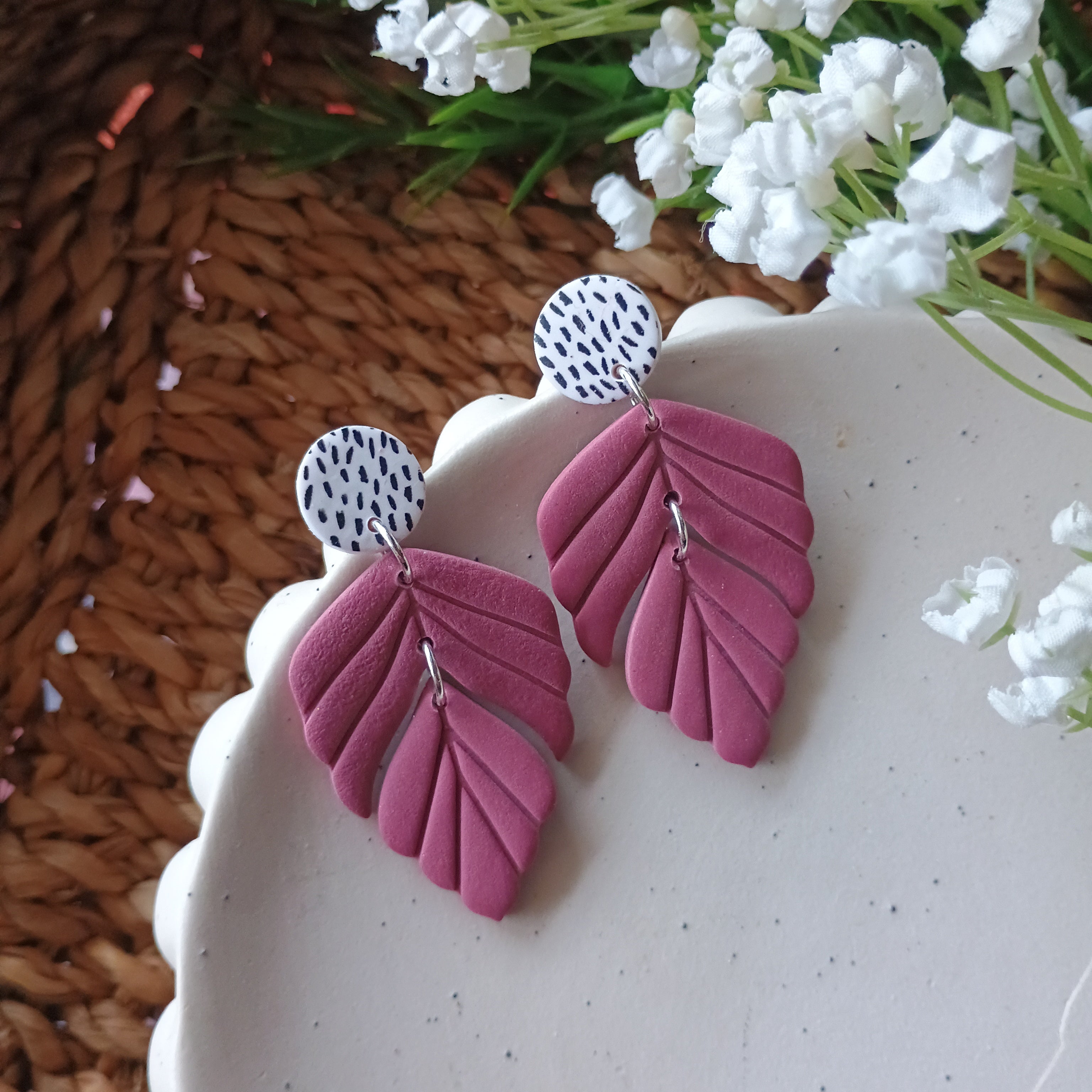 Plum coloured embossed leaf earrings with silkscreen painted stud