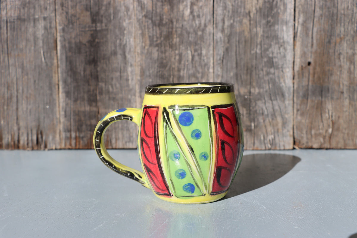 Hand-Painted Mug: Abstract yellow, red, green, black and blue mid-fire stoneware