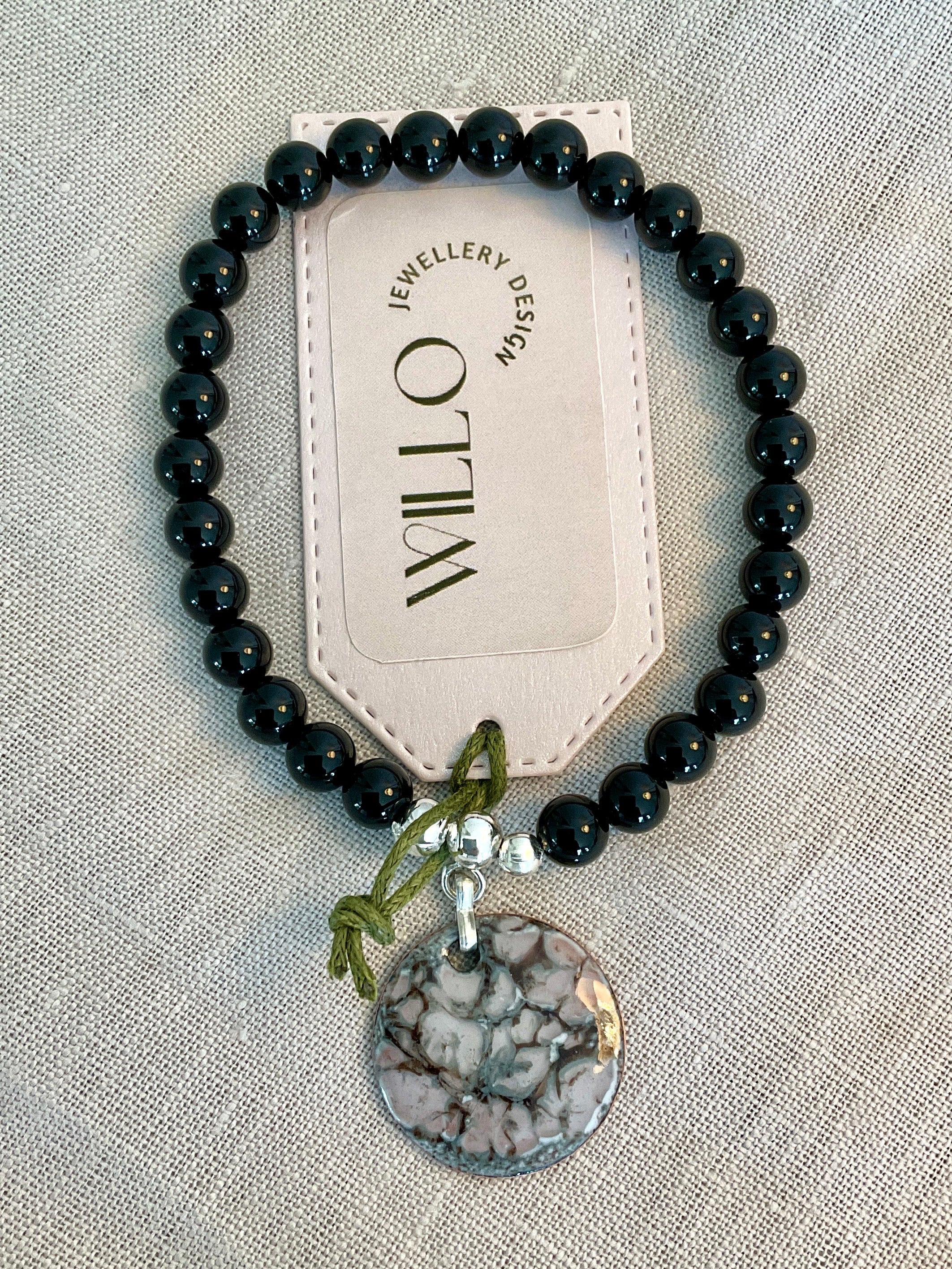 Black Onyx beaded bracelet with enamel charm