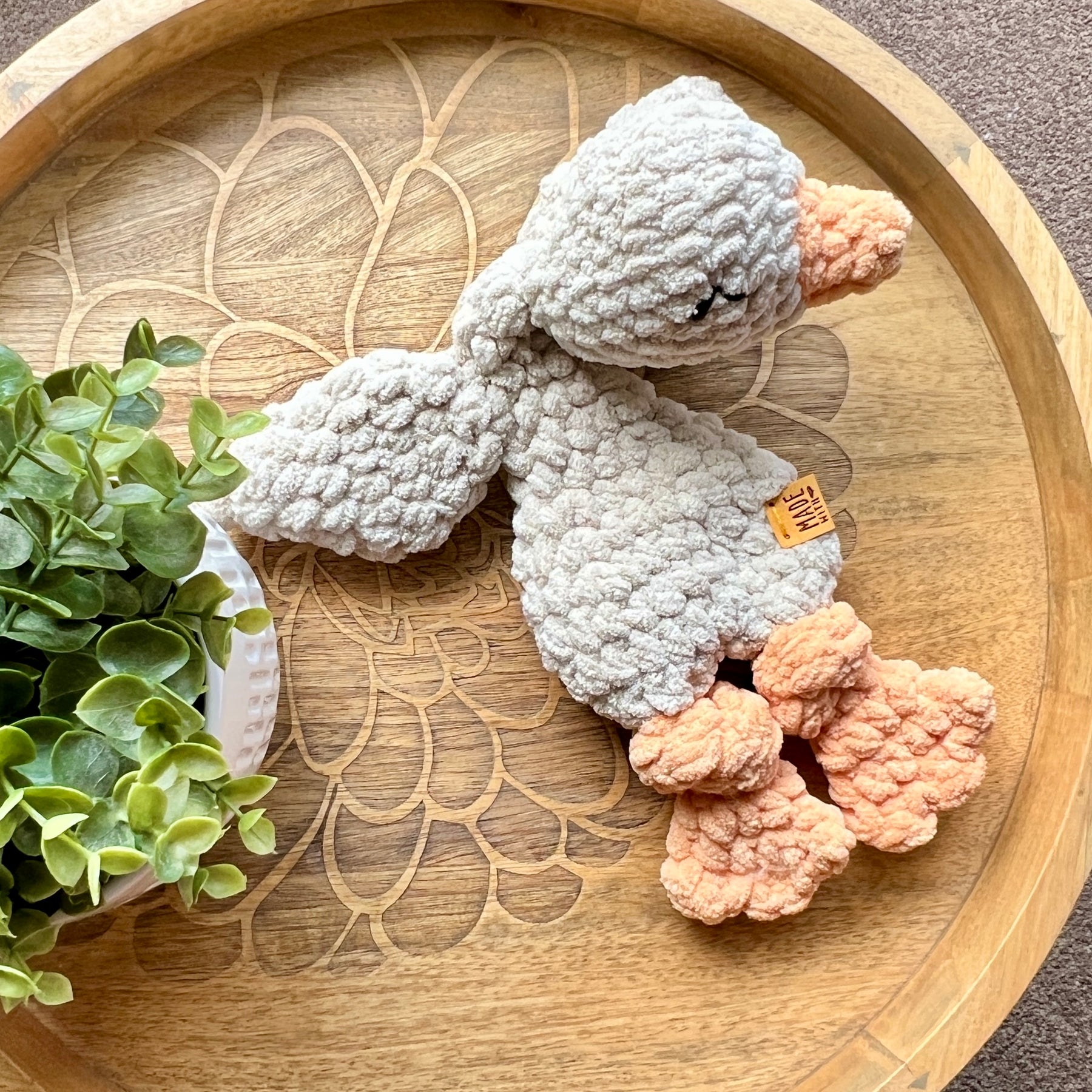 Handmade crochet Mini Goose modern lovey with knotted legs.