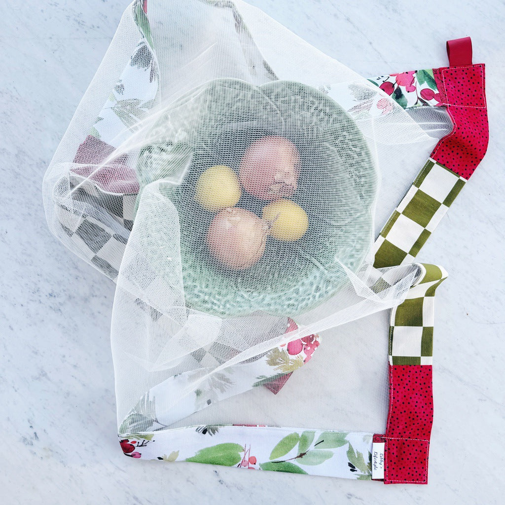 Red and green weighted mesh food cover.