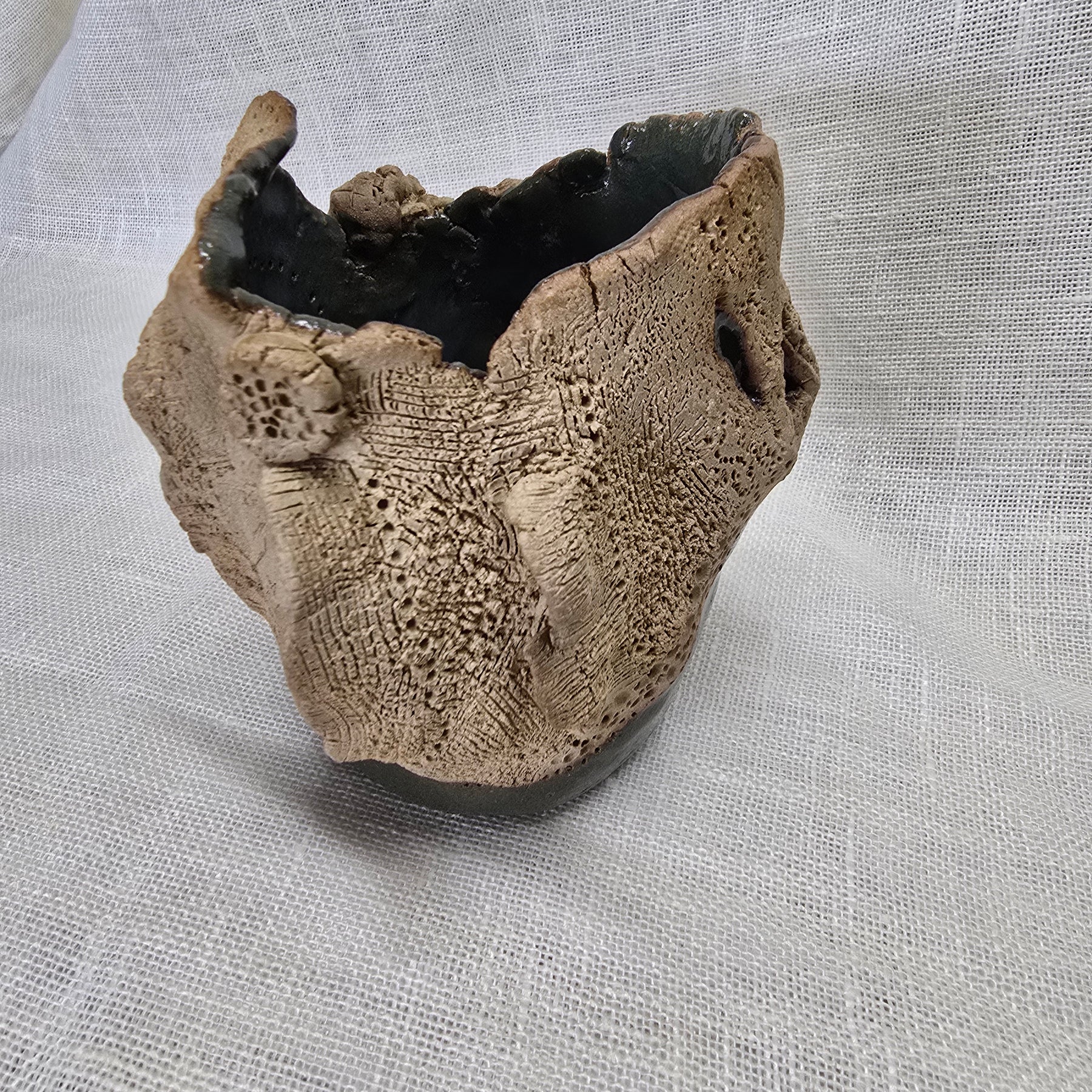 Rockpool series.  Stunning, hand carved pot