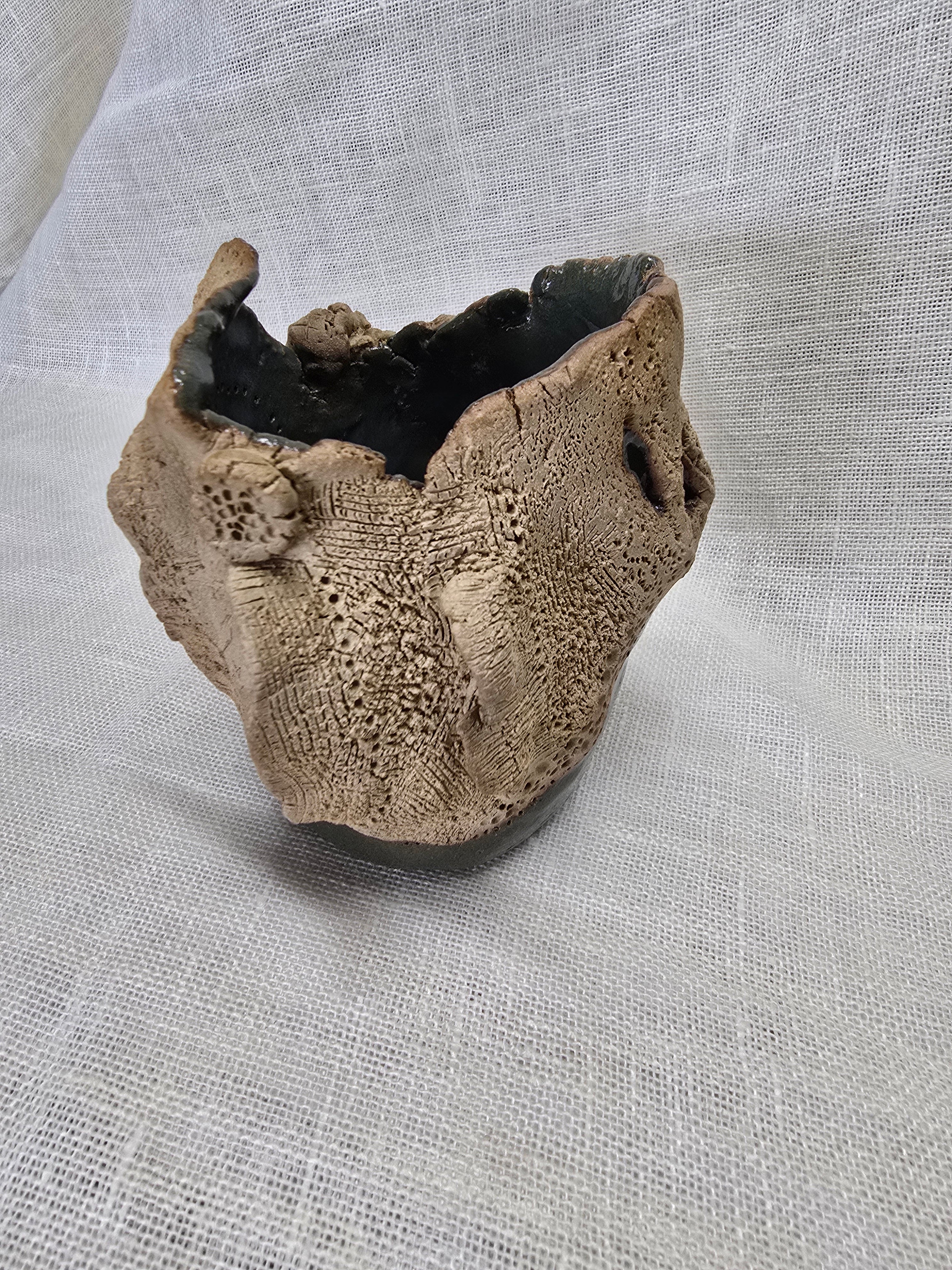 Rockpool series.  Stunning, hand carved pot