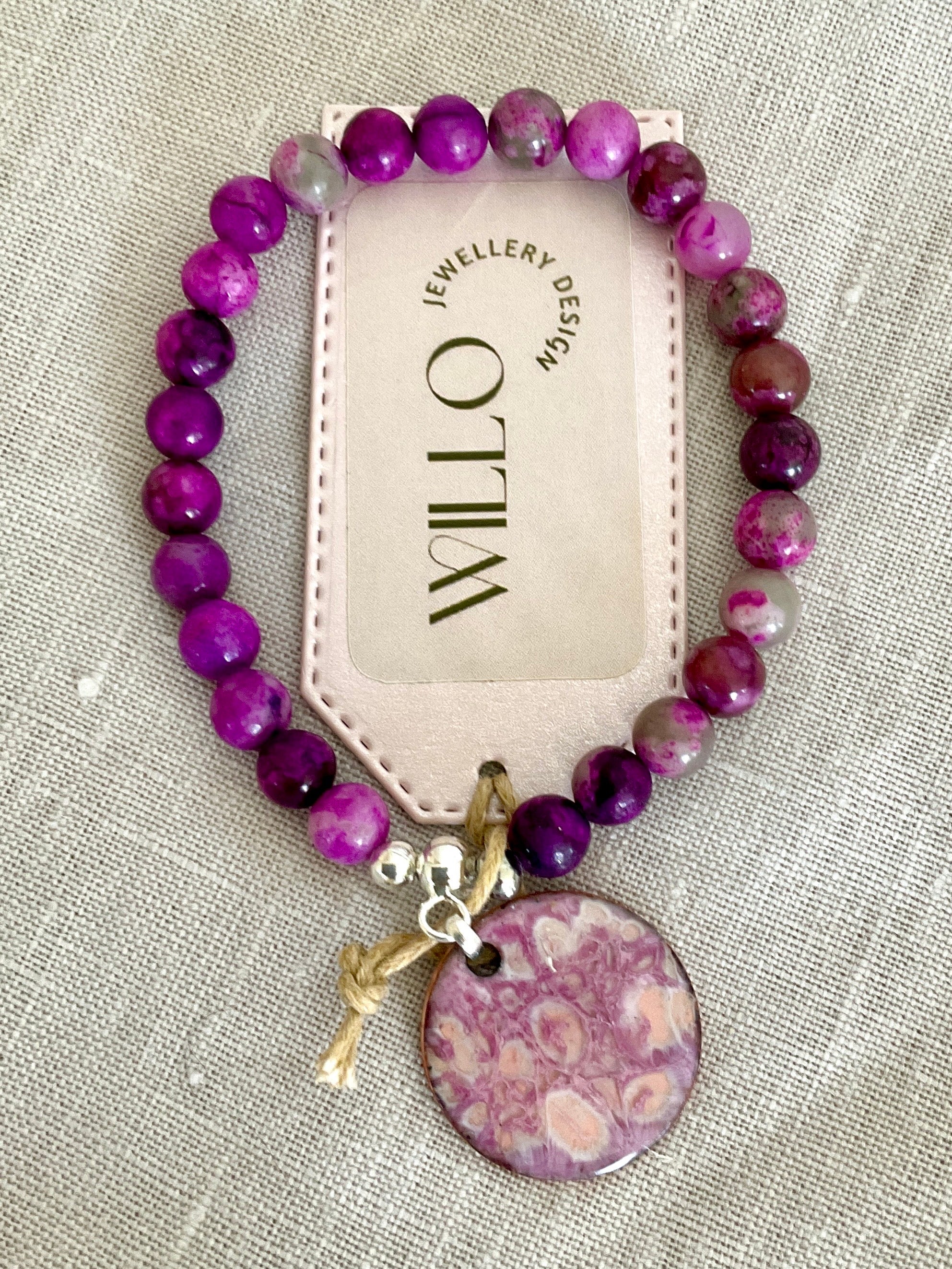 Pink charolite gemstone bracelet with enamel charm