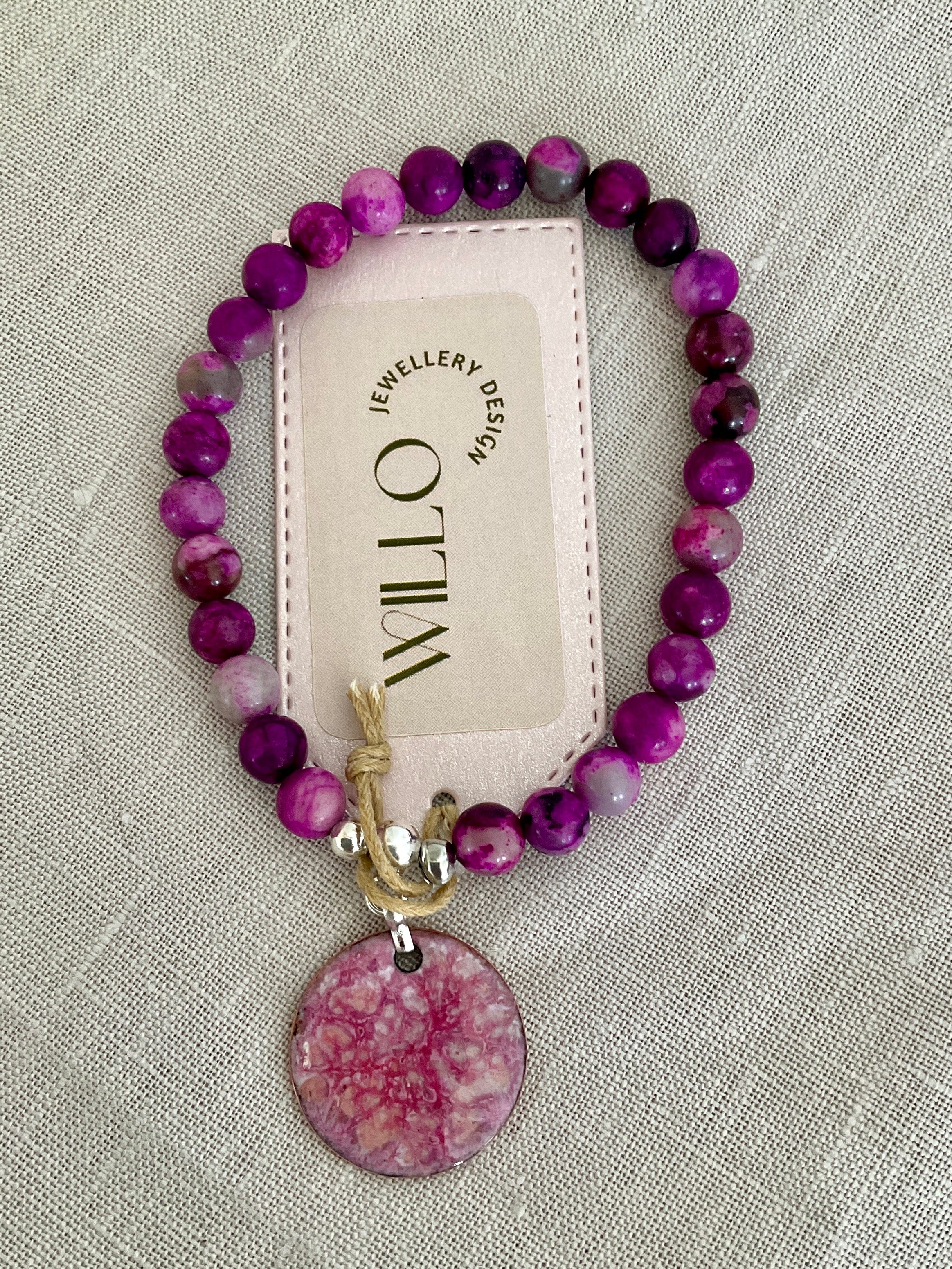 Pink charolite gemstone bracelet with enamel charm