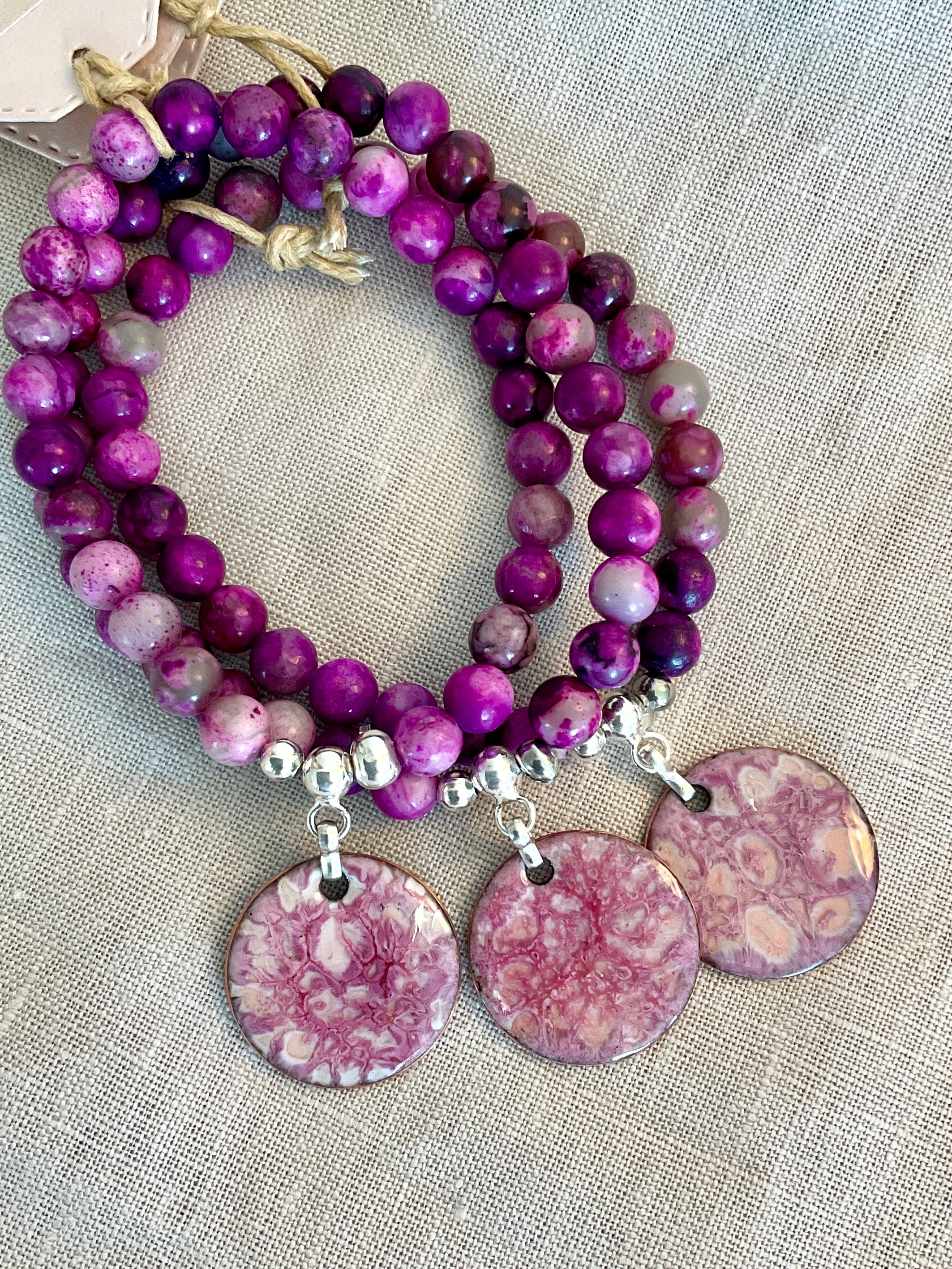 Pink charolite gemstone bracelet with enamel charm