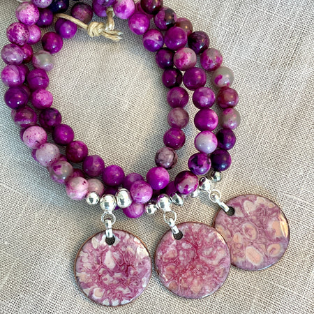 Pink charolite gemstone bracelet with enamel charm