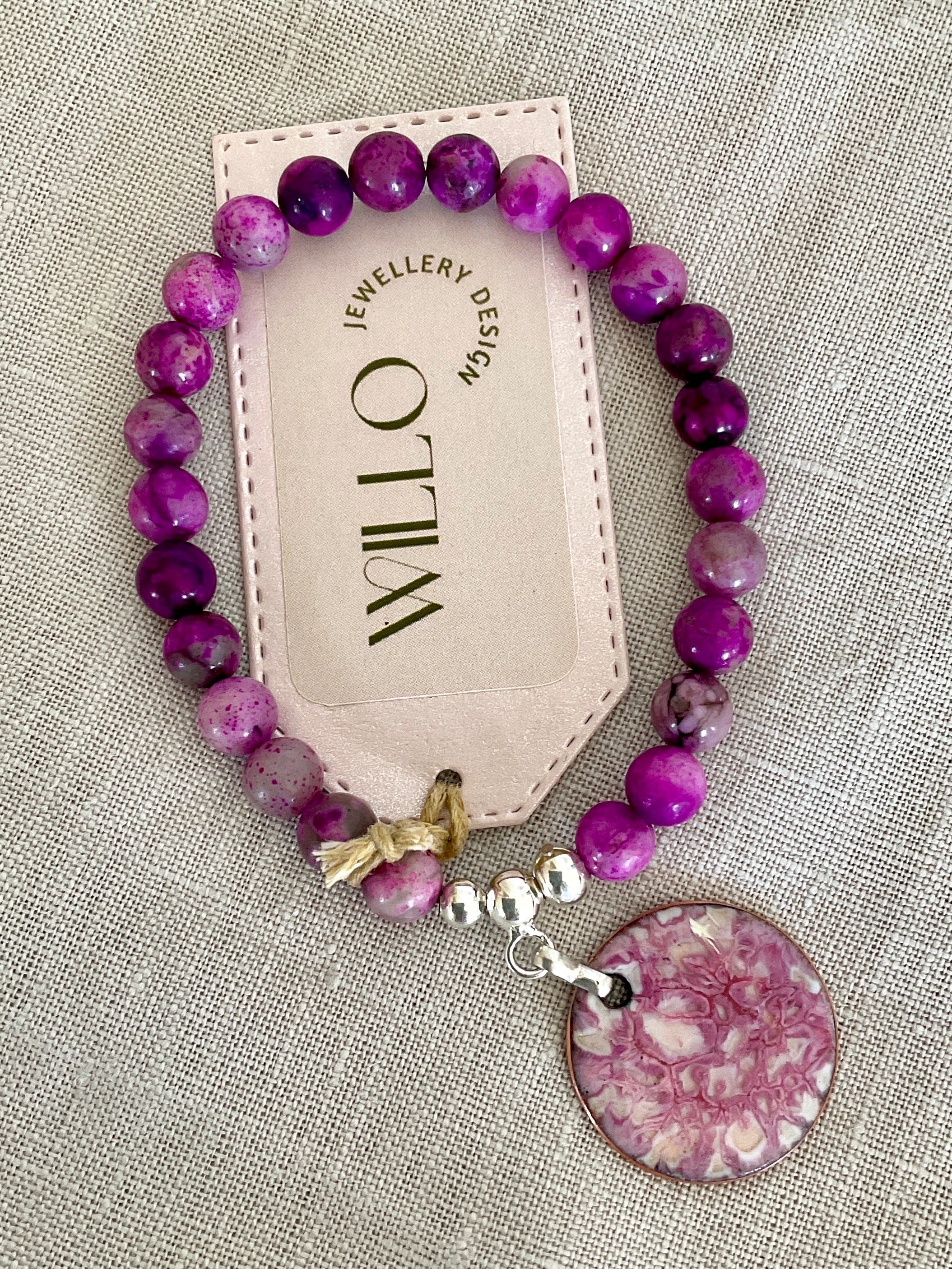 Pink charolite gemstone bracelet with enamel charm