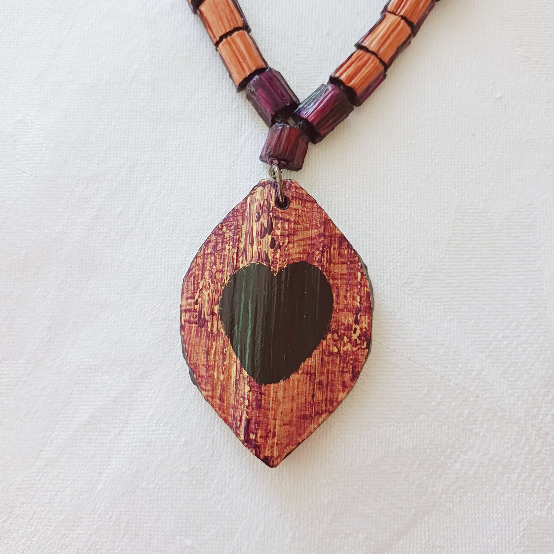 Hand painted Heart pendant on palm leaf bead necklace
