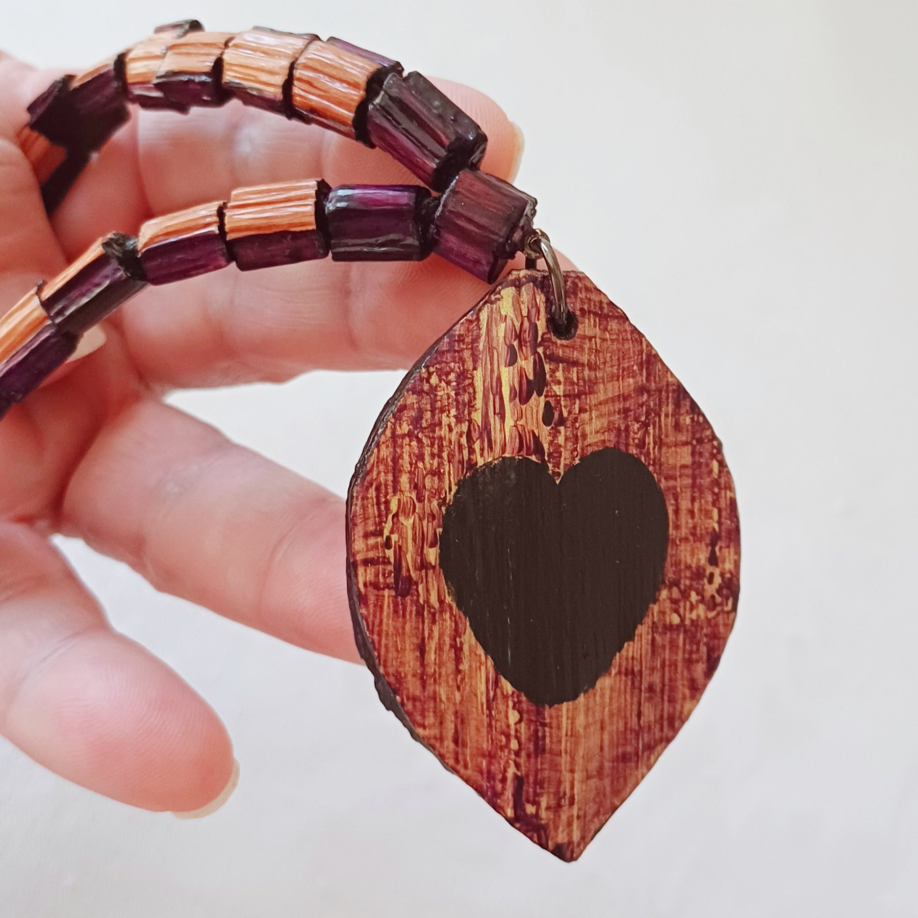 Hand painted Heart pendant on palm leaf bead necklace