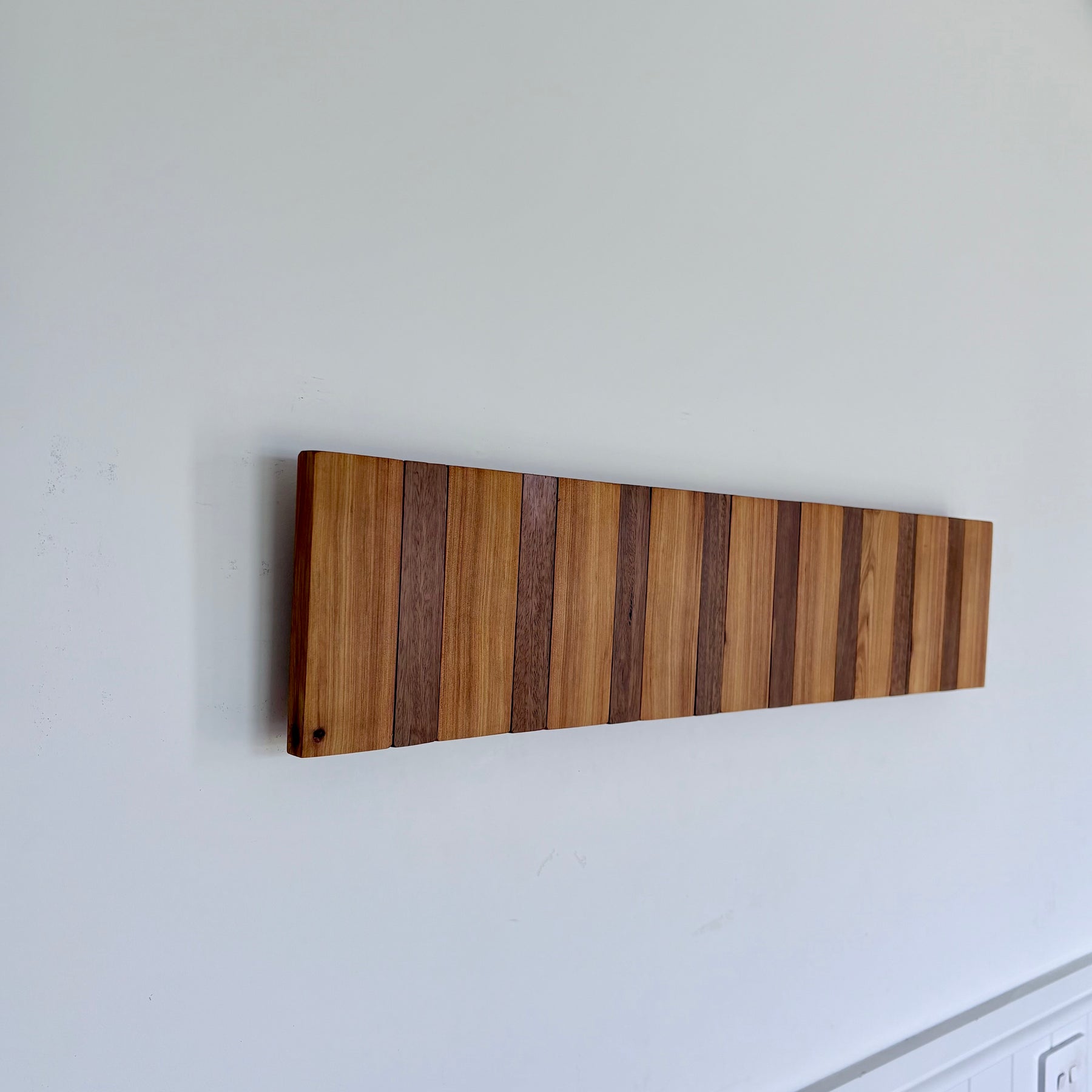 Two tone spotted gum and cypress horizon line piano style coatrack