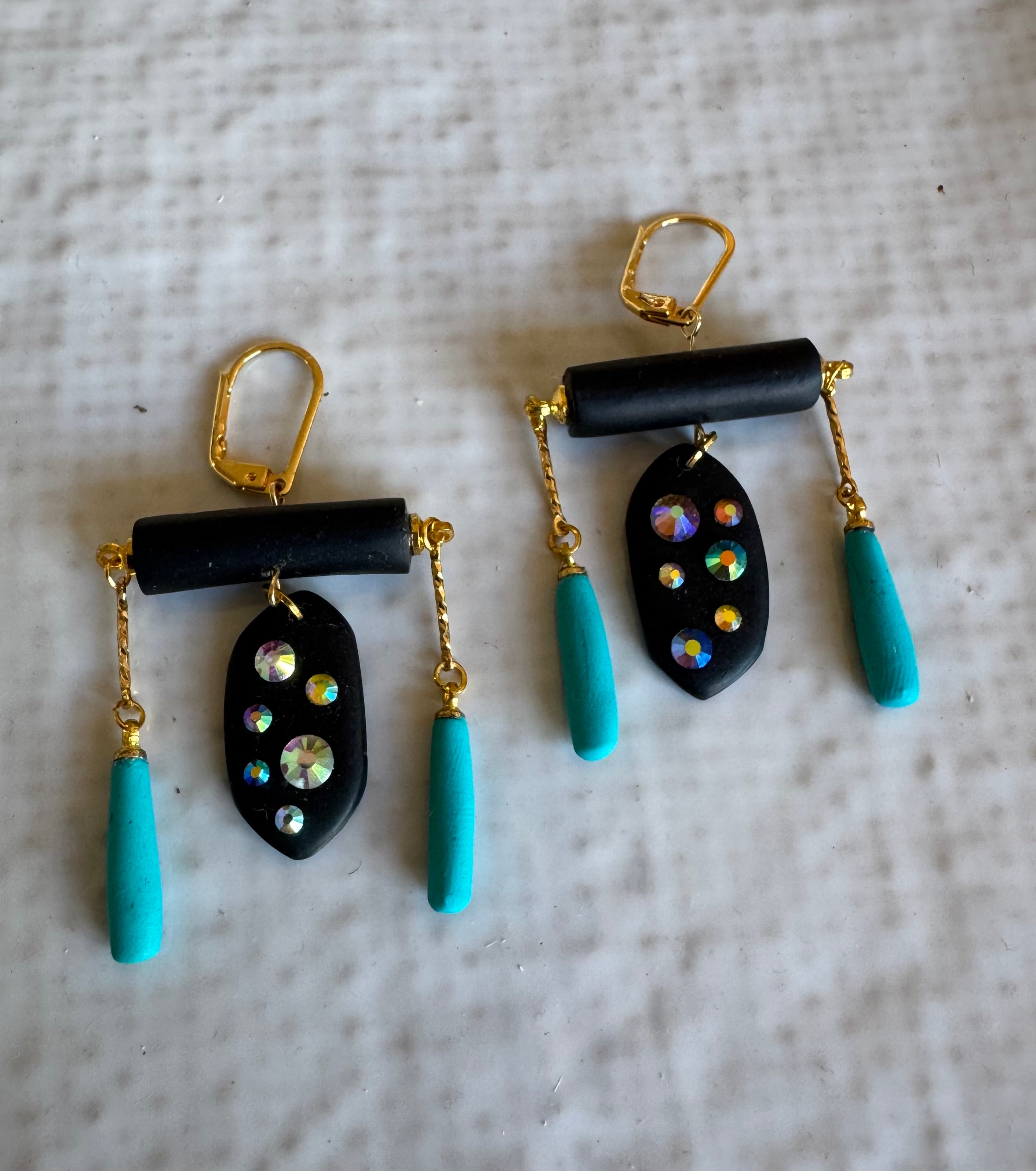 Black rod earrings with holographic gems