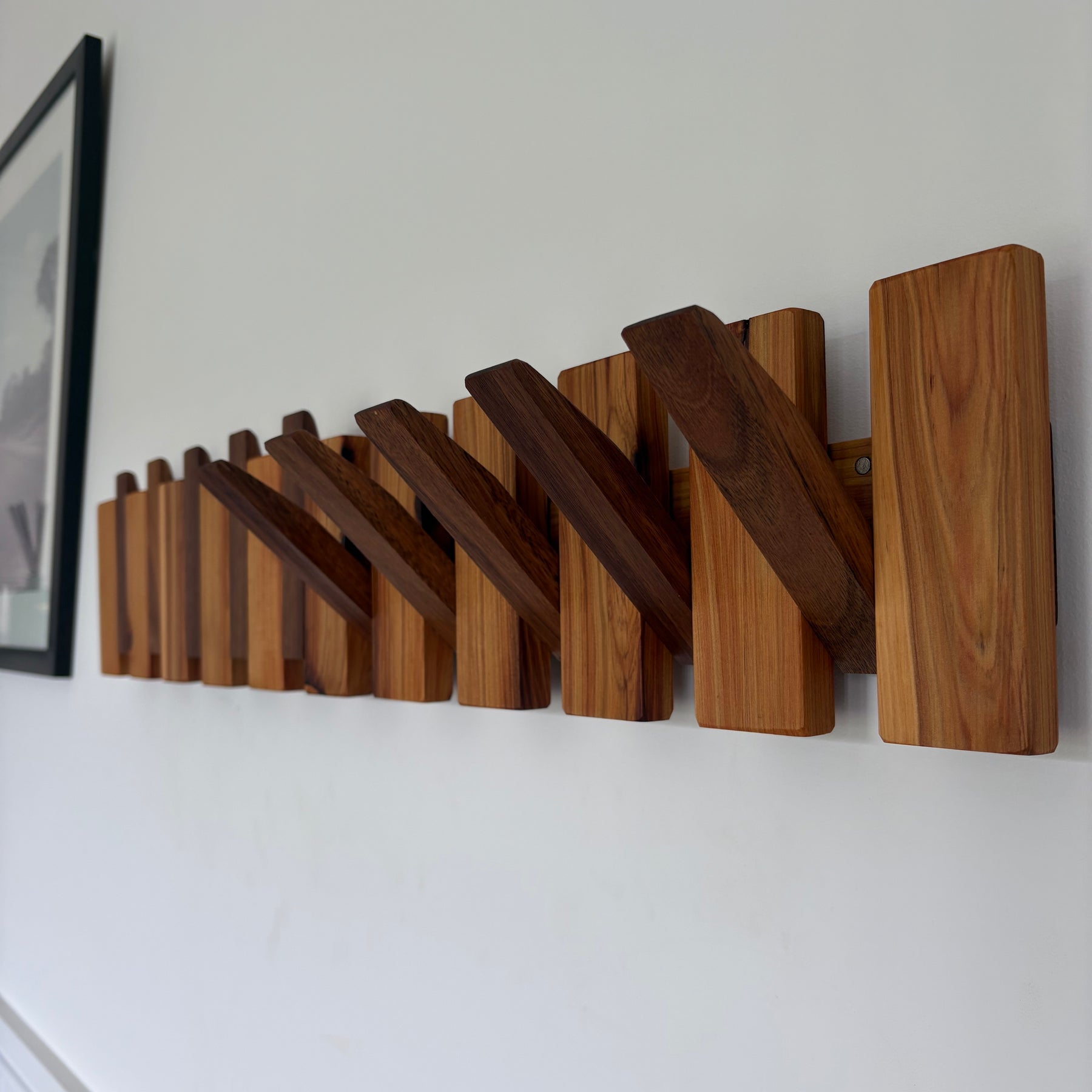 Two tone piano style coatrack