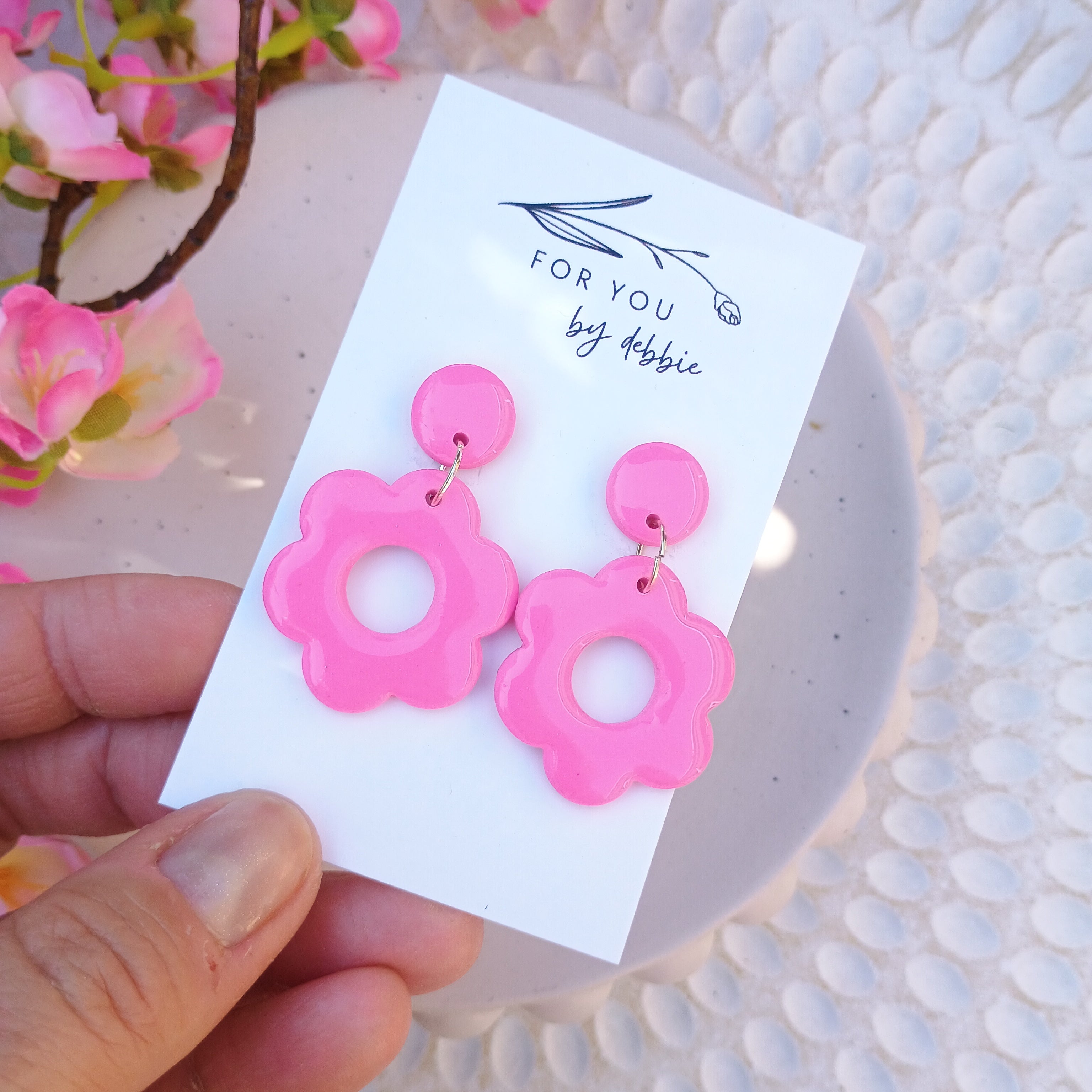 Bright pink daisy dangle earrings