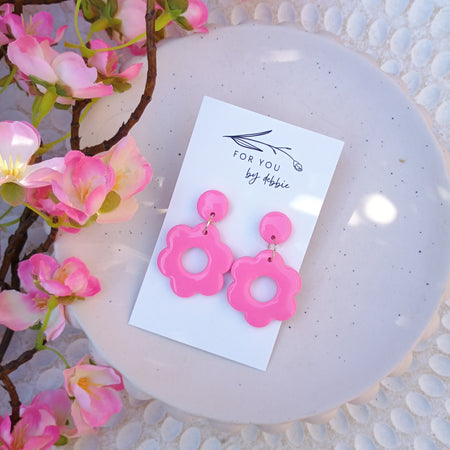Bright pink daisy dangle earrings