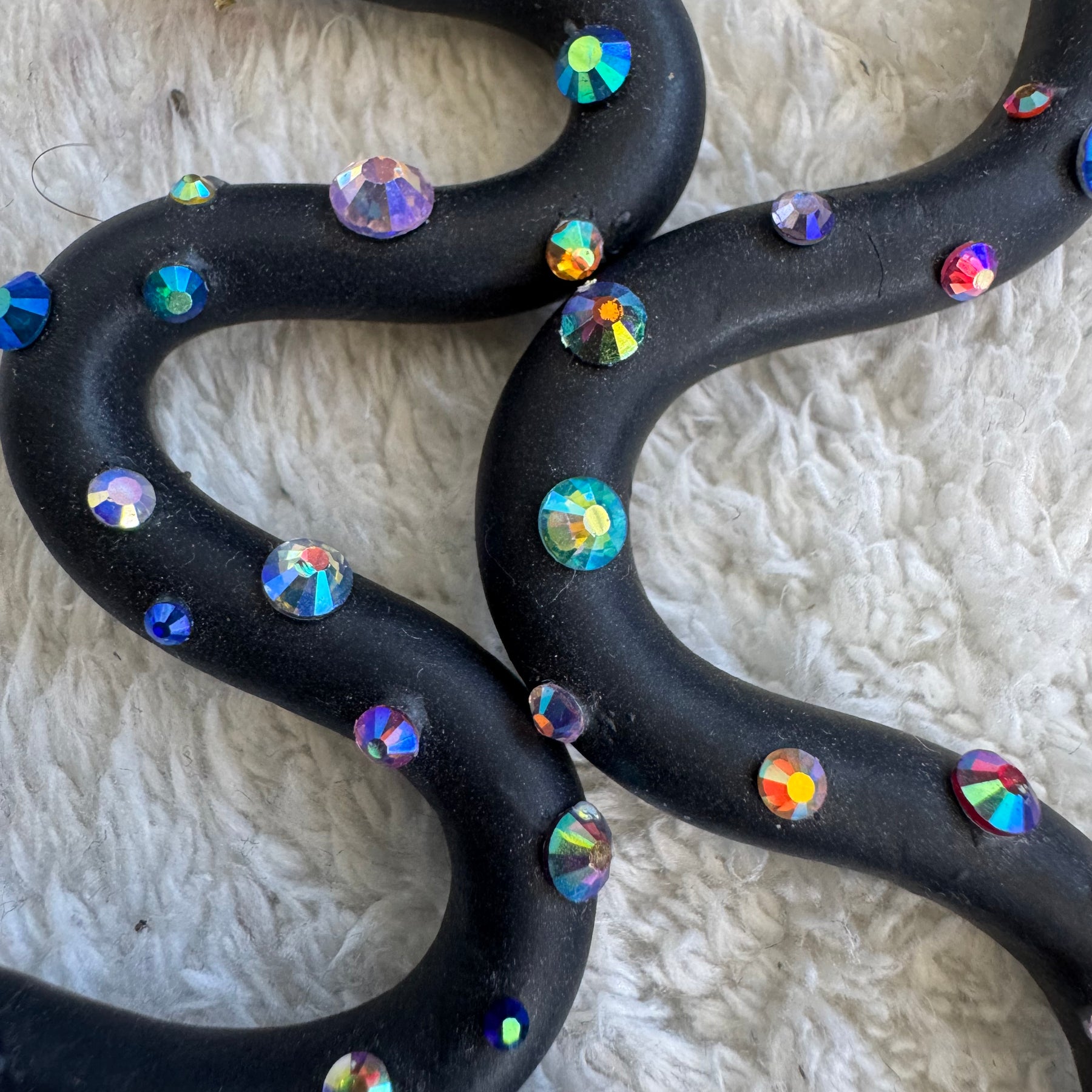 Black squiggle polymer clay earrings with holographic gems