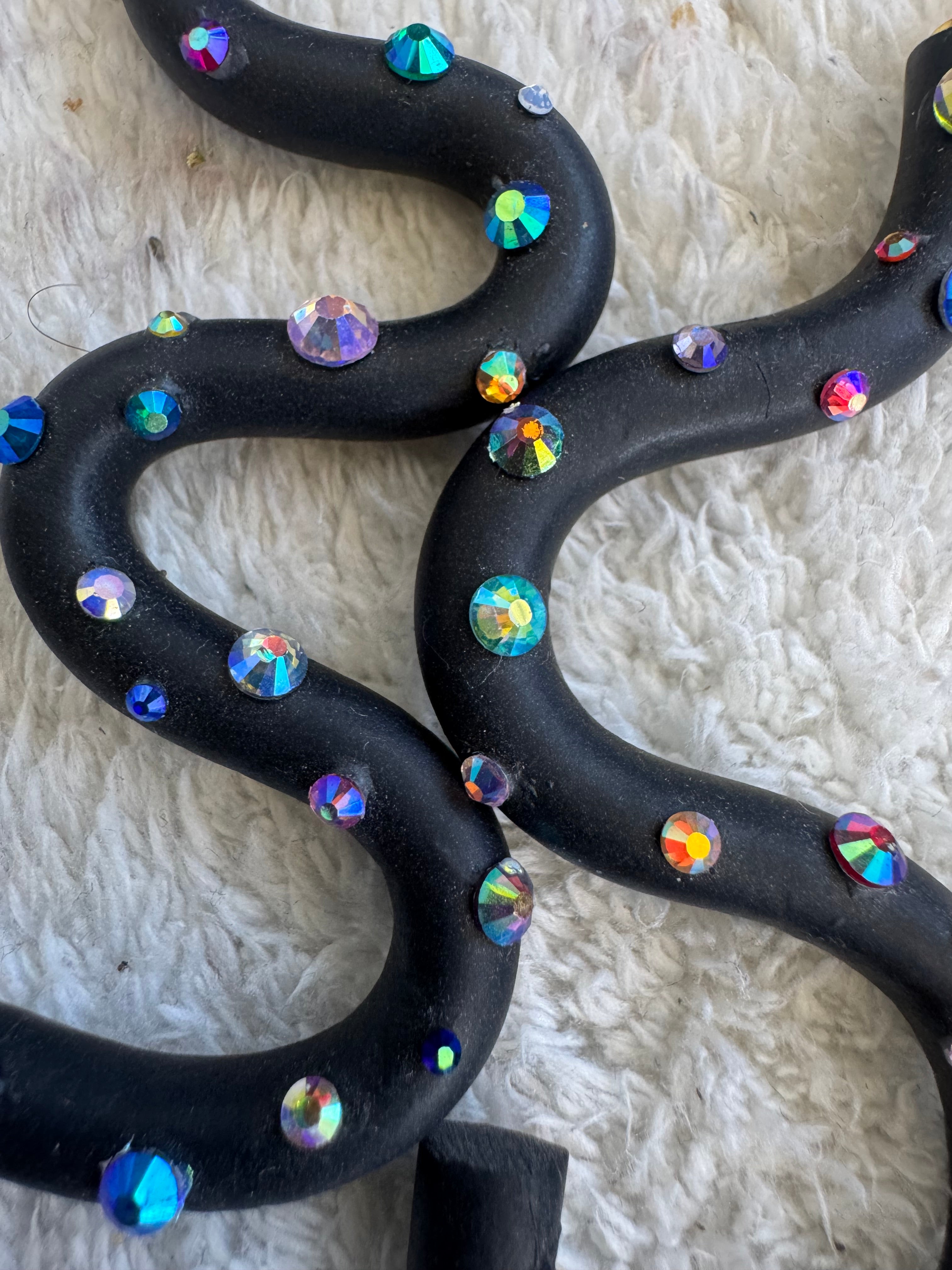 Black squiggle polymer clay earrings with holographic gems