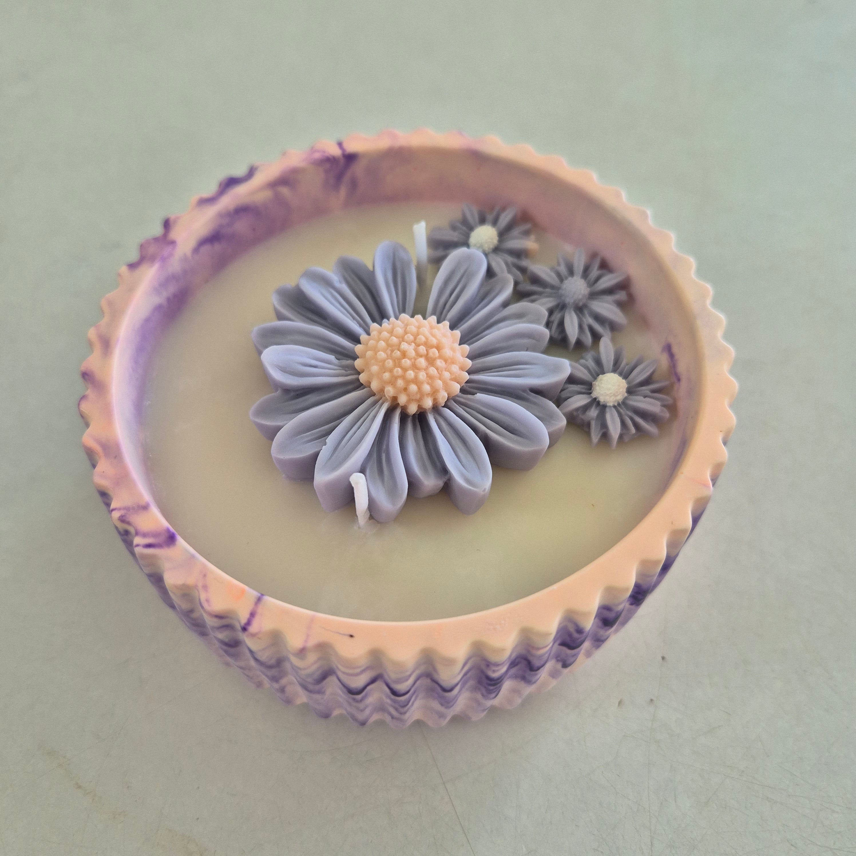 Round orange and purple concrete bowl candle with rose and lavender scent
