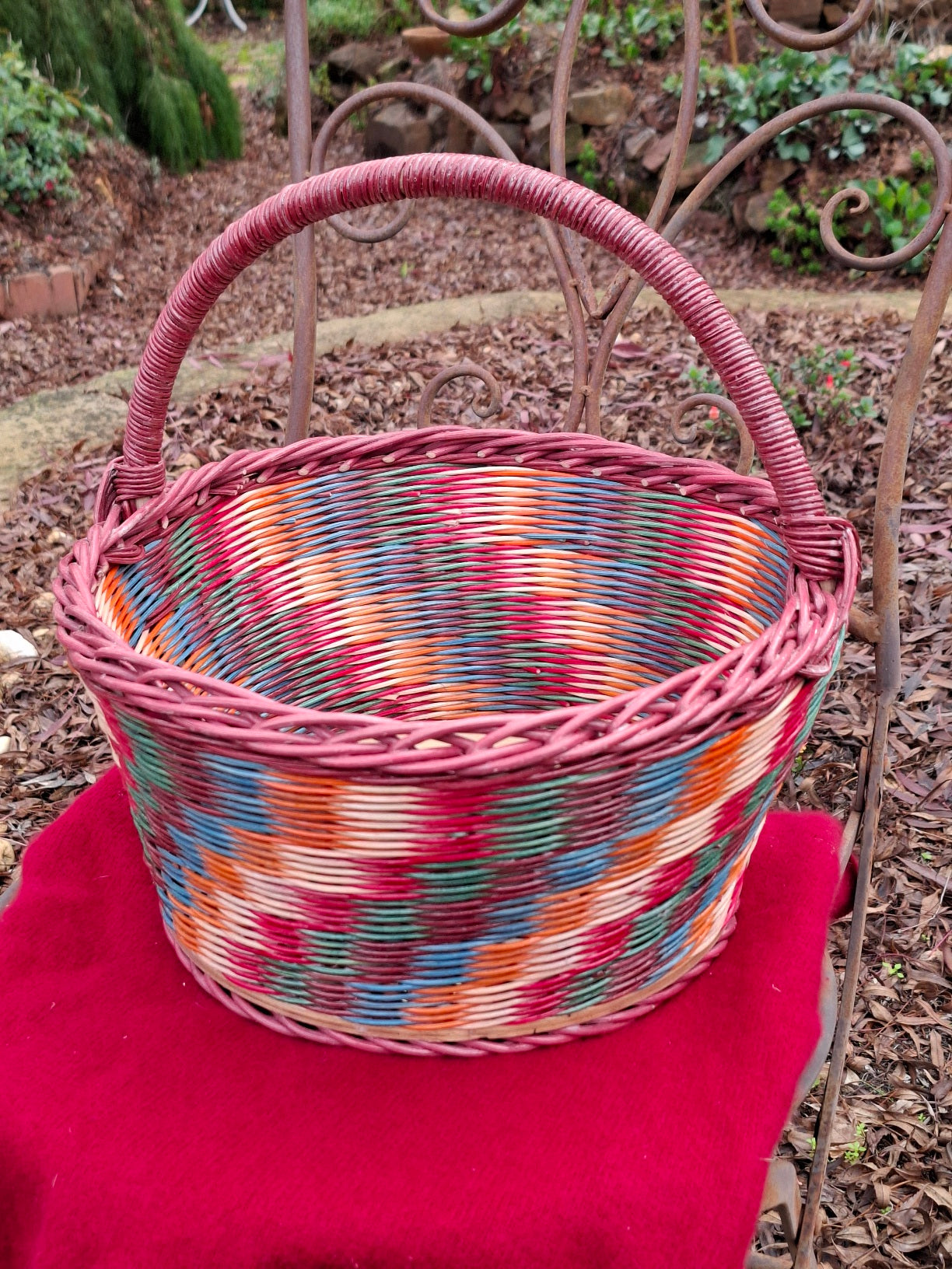 Large Round Market Basket brown, blue, orange, red and natural. Handle brown.