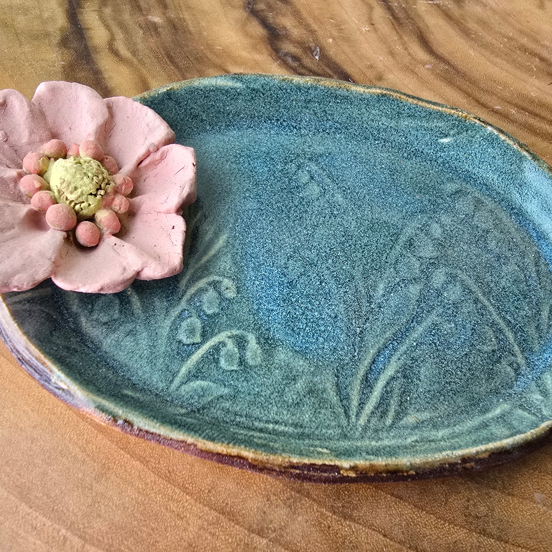 Turquoise floral trinket dish.