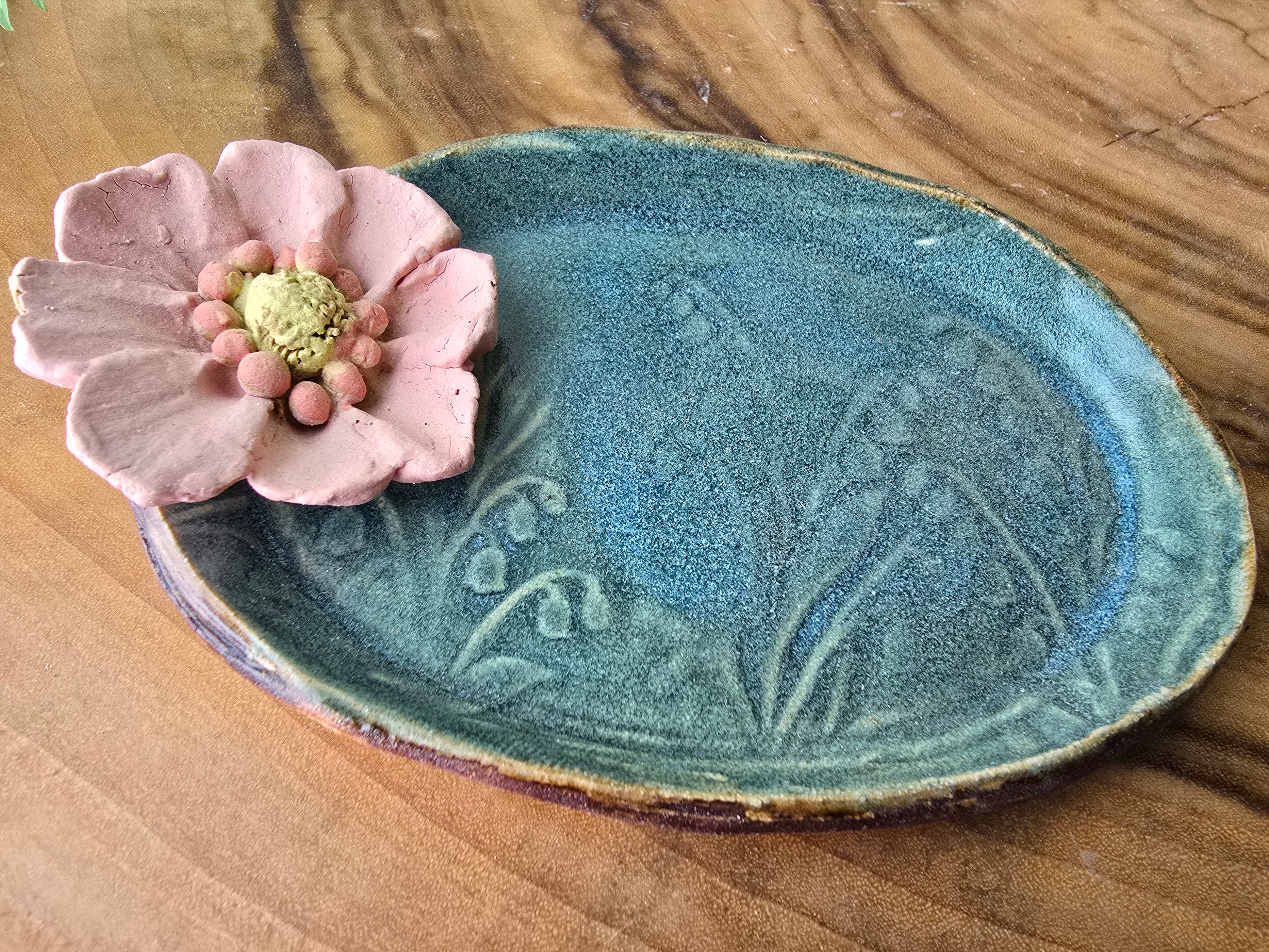 Turquoise floral trinket dish.