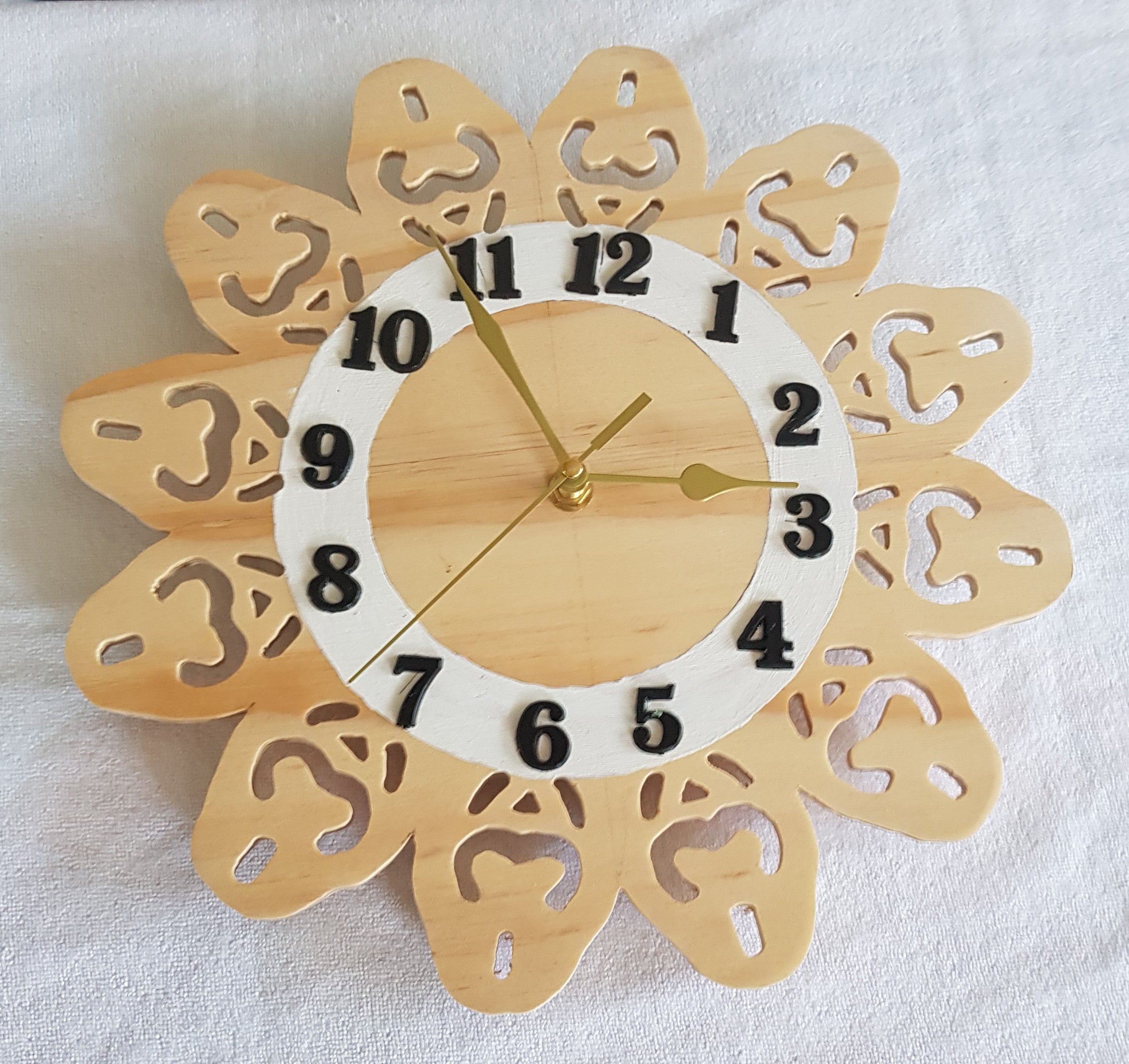 Clock 8: has a 60 scroll sawn cutout scround.