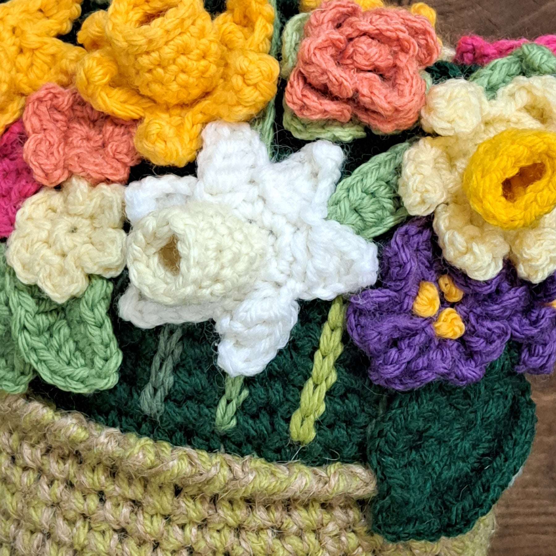 Crochet doorstop/ spring flowers in a yellow vase.