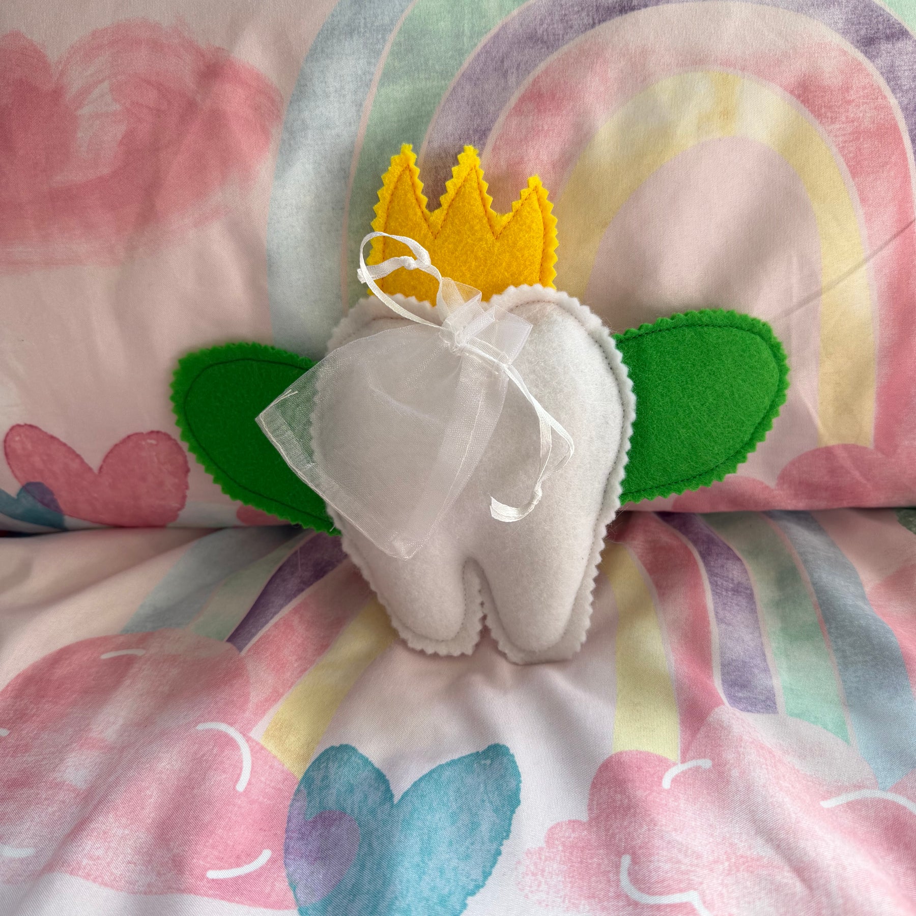 Tooth fairy snuggle toy with tooth pouch