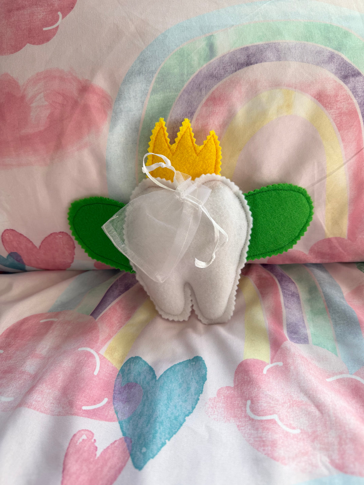 Tooth fairy snuggle toy with tooth pouch