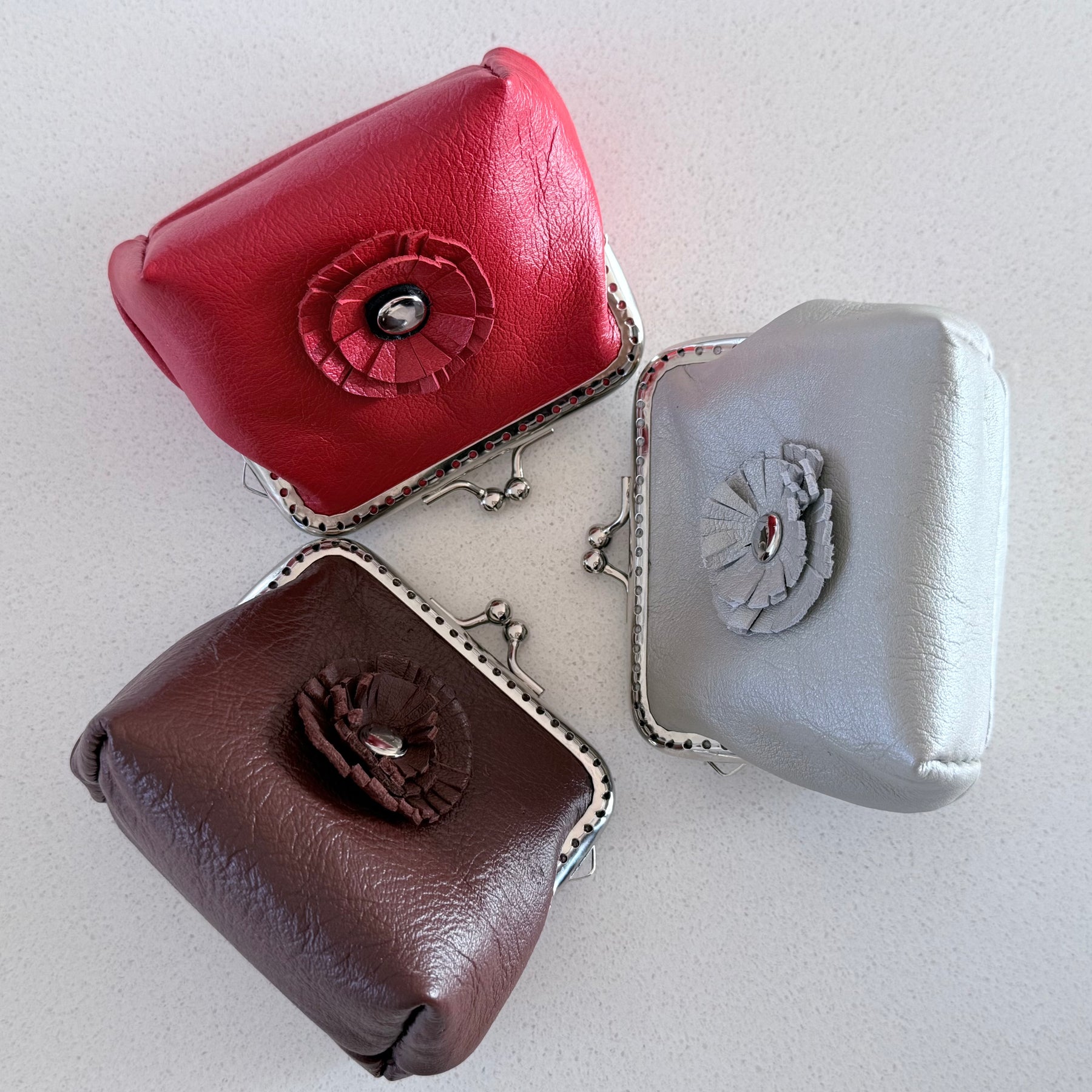 Coin purse with rosette flower accent