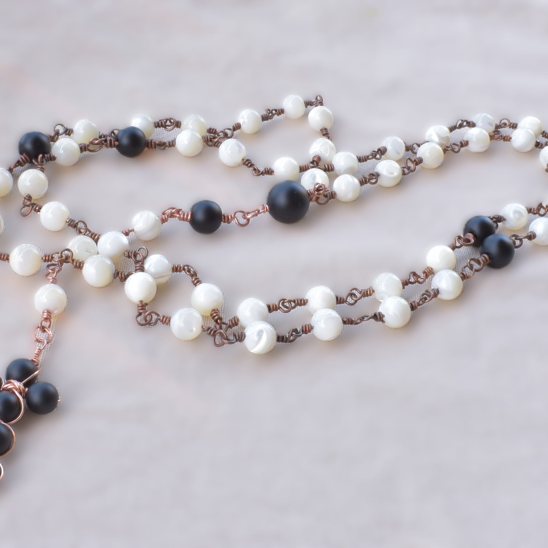 Stillness — Copper Wire Wrapped Rosary Mother of Pearl & Onyx