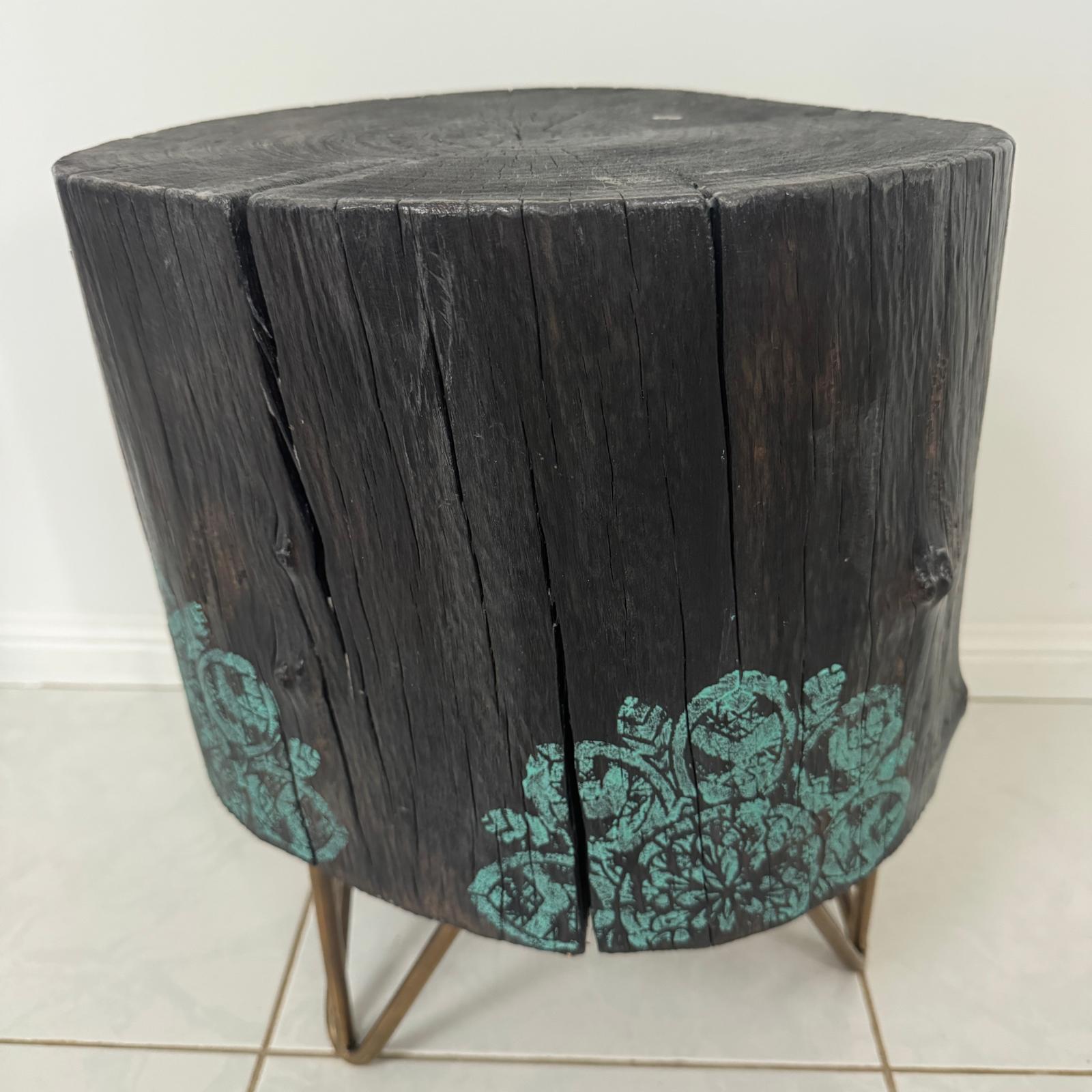 Timber stump table featuring teal mandala hand-painted artwork