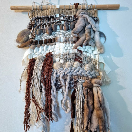 Handwoven textured wall hanging in grey, brown and white