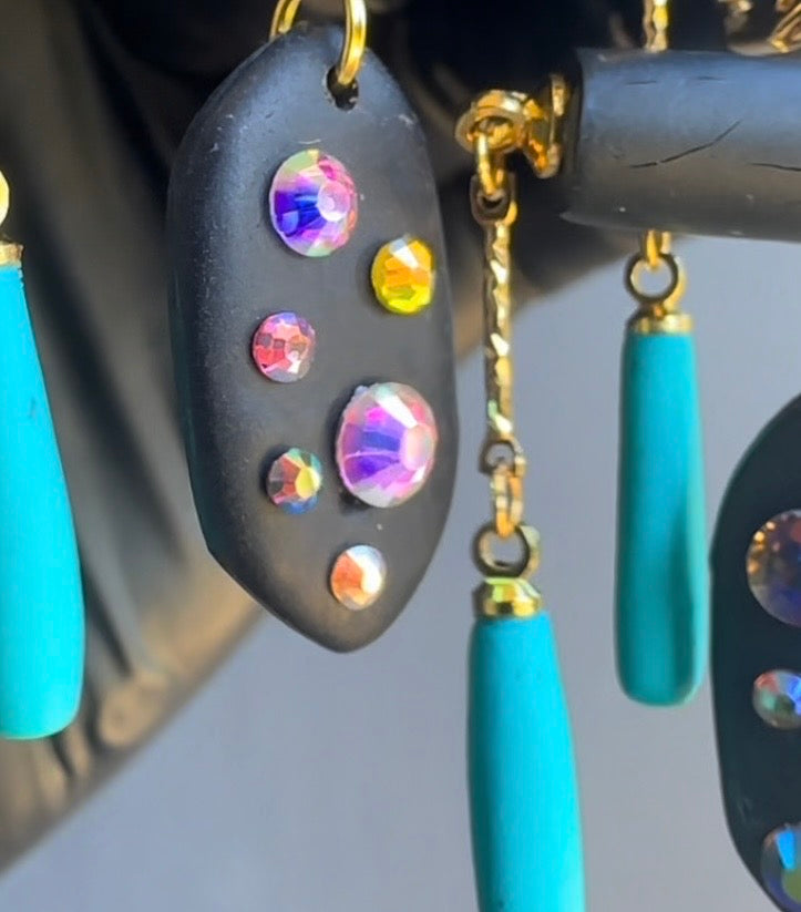 Black rod earrings with holographic gems
