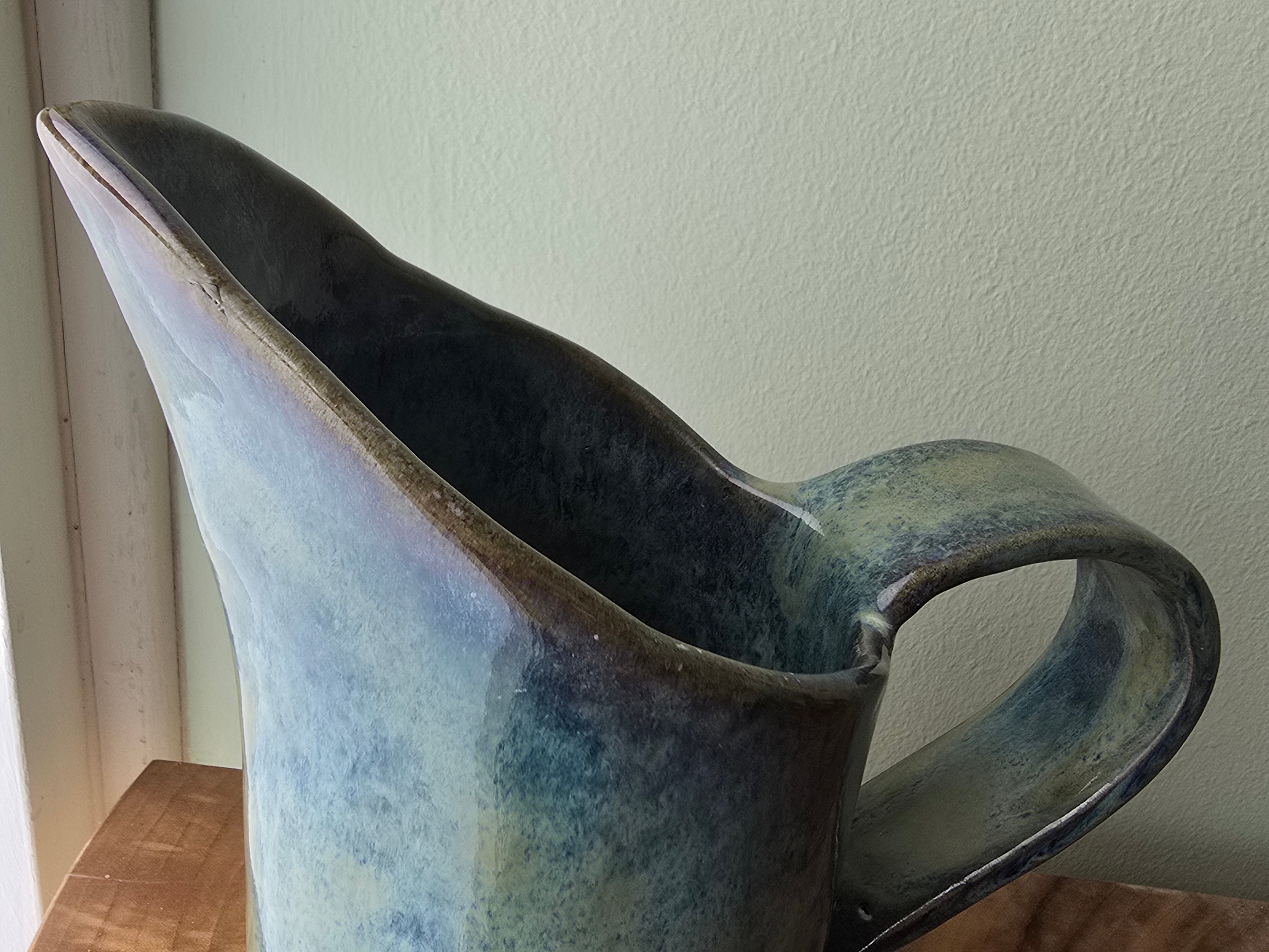 Large blue-green ceramic jug