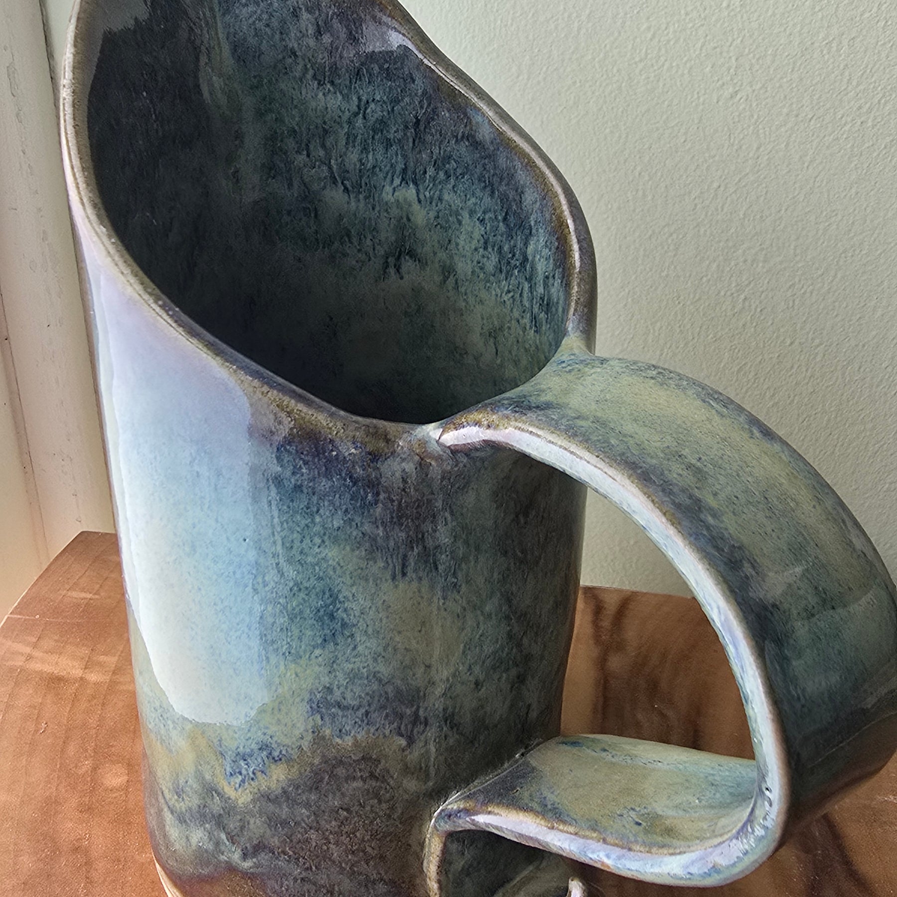 Large blue-green ceramic jug