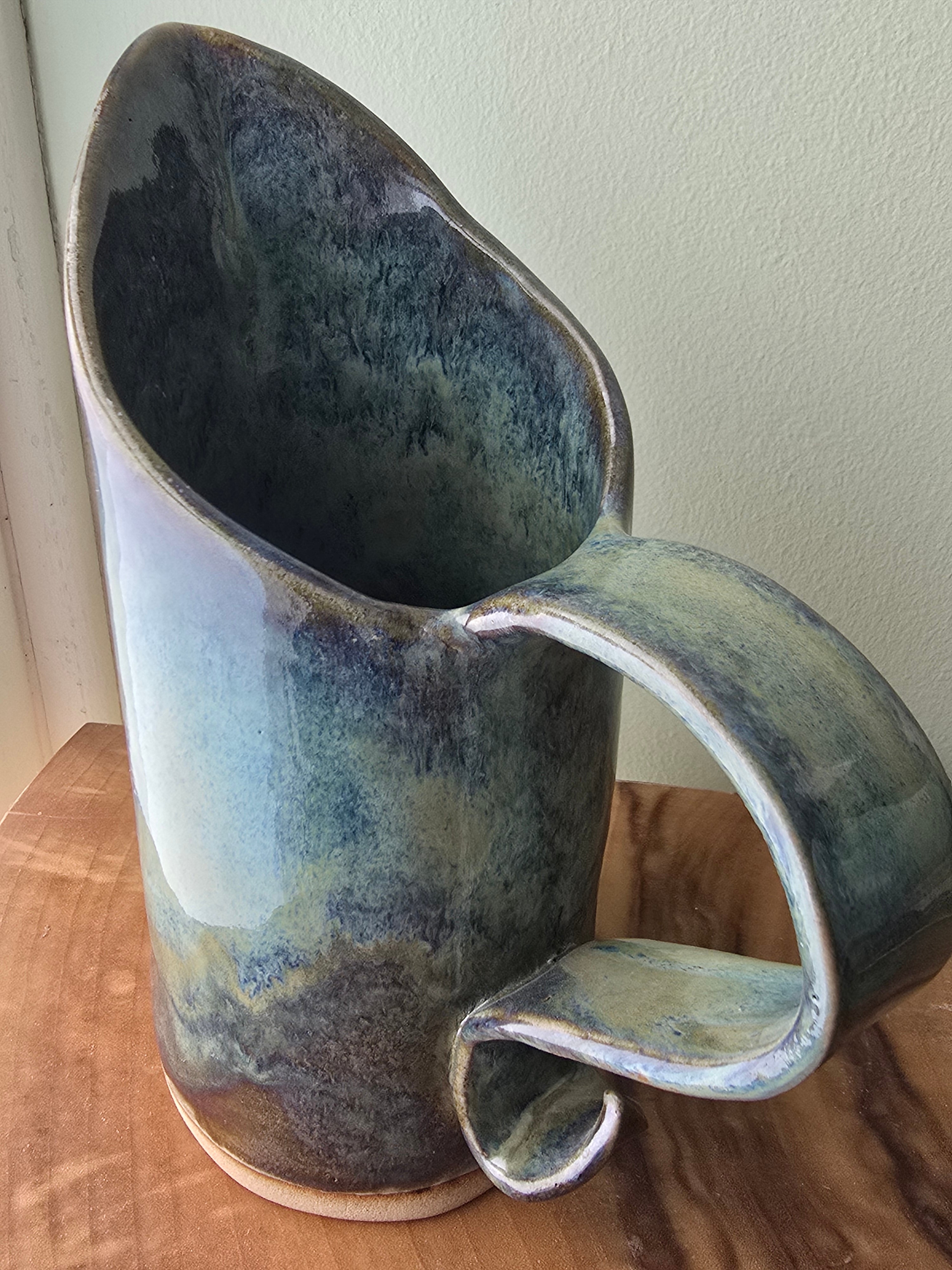 Large blue-green ceramic jug