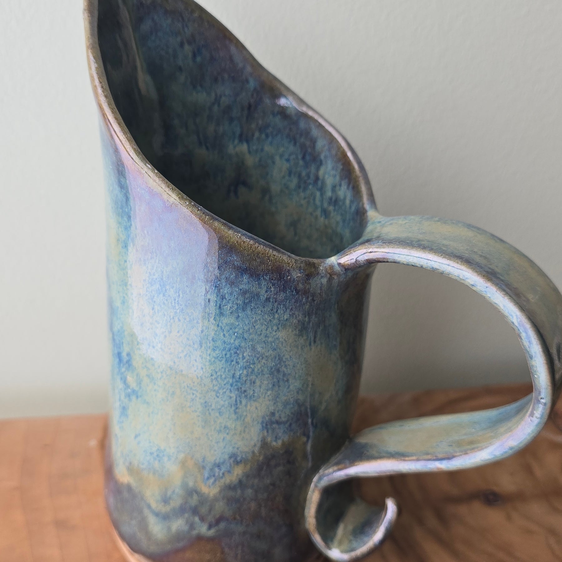 Large blue-green ceramic jug