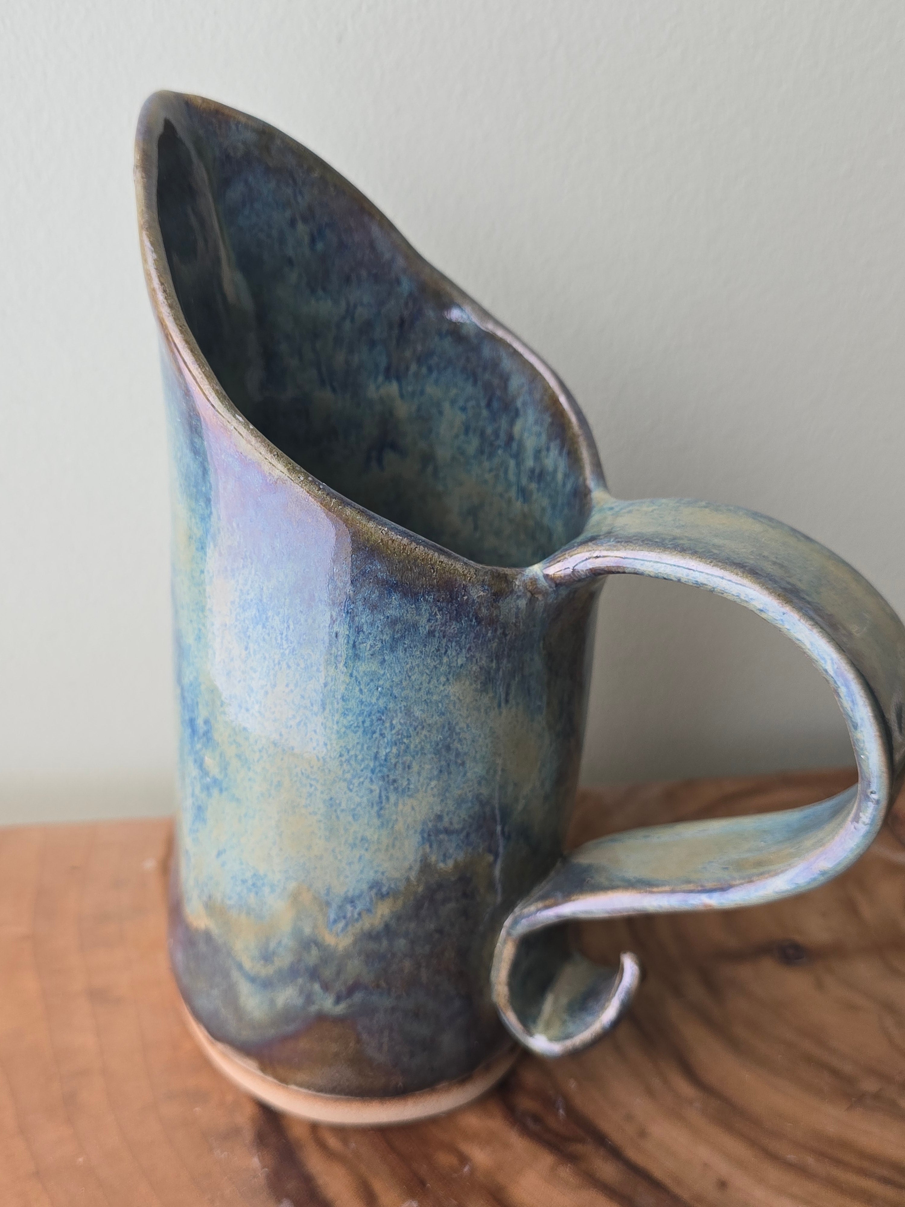 Large blue-green ceramic jug