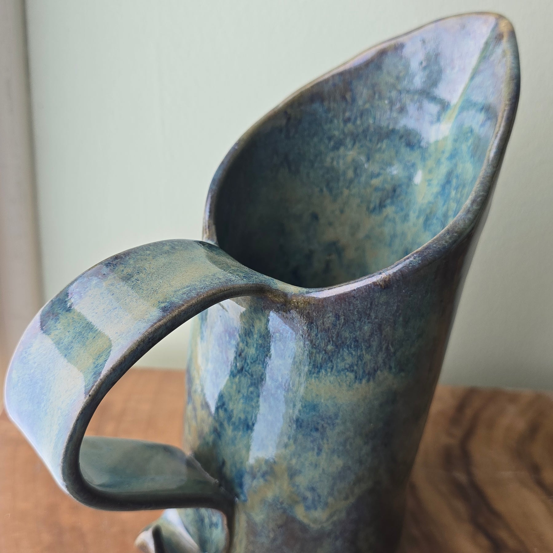 Large blue-green ceramic jug