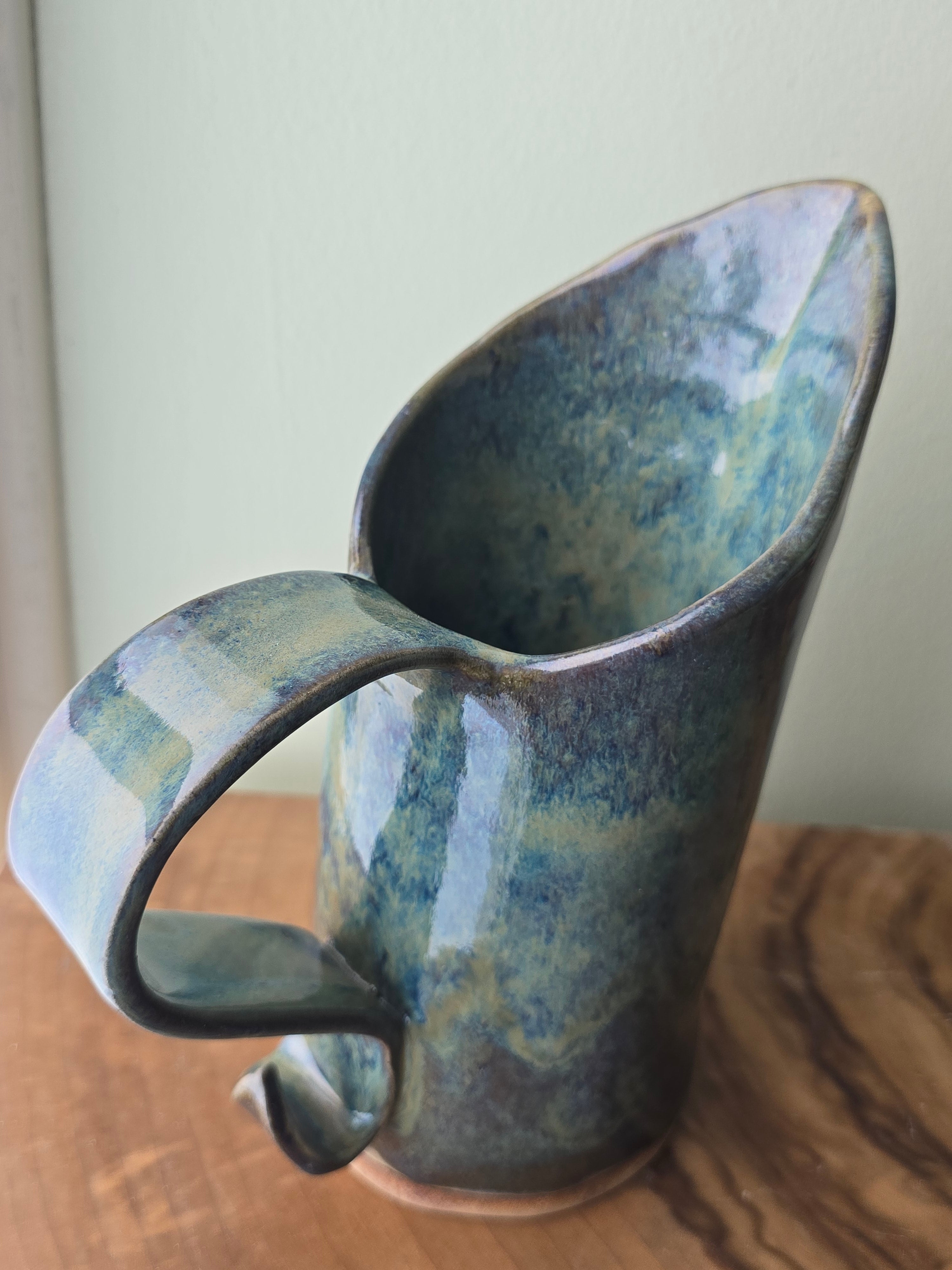 Large blue-green ceramic jug