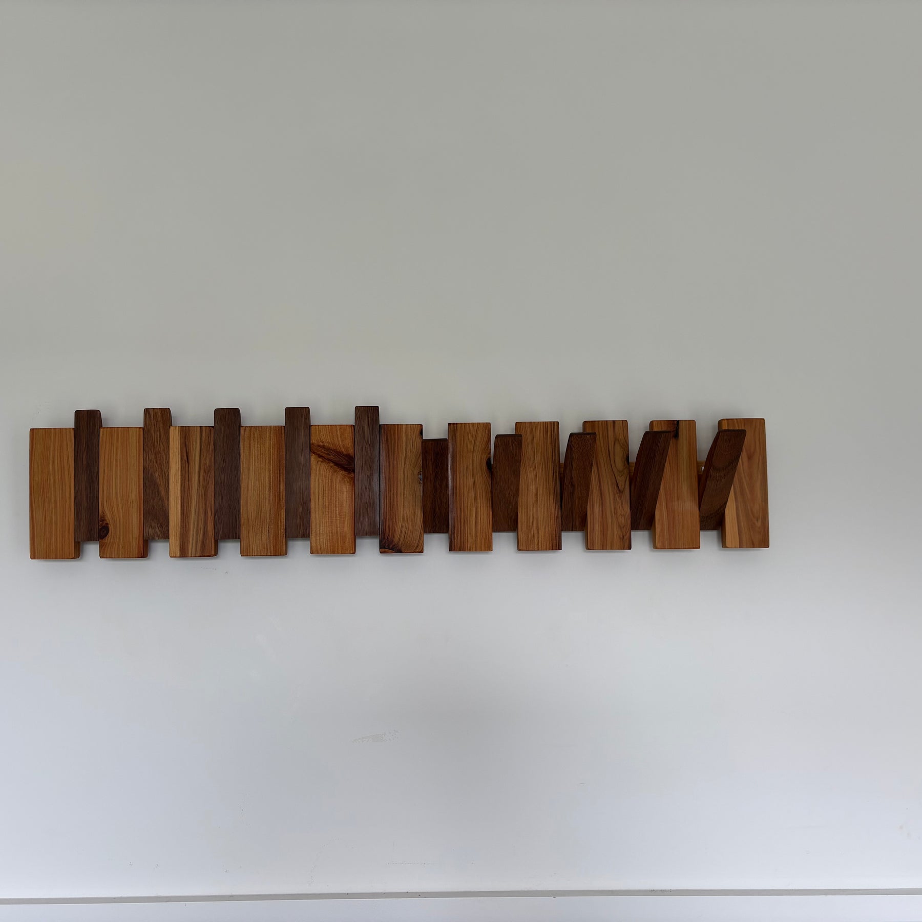 Two tone piano style coatrack