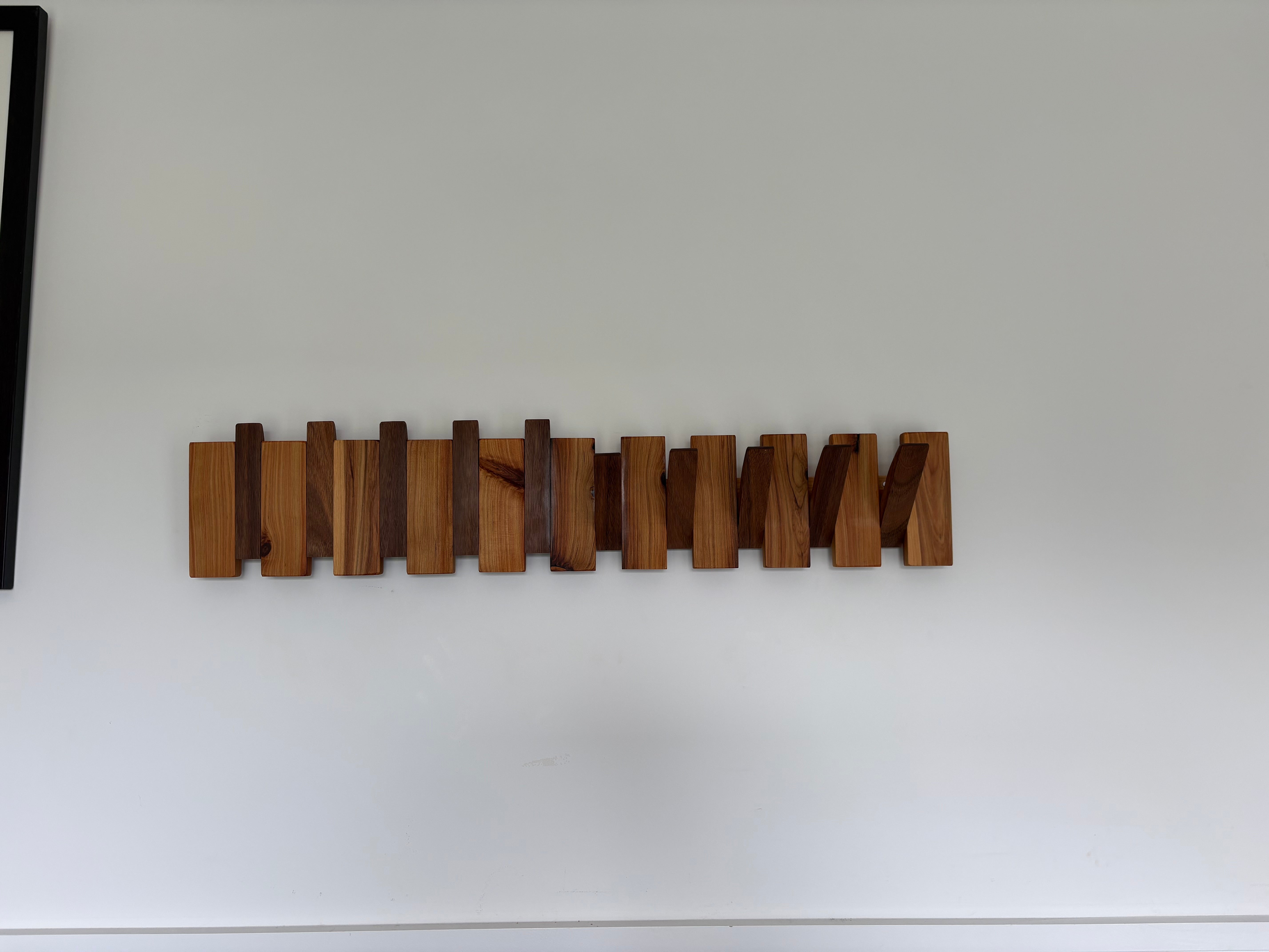 Two tone piano style coatrack